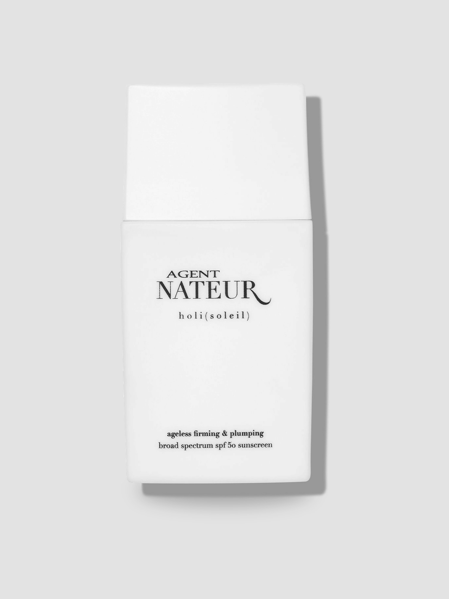 Agent Nateur Holi (Soleil) SPF 50 Sunscreen in colorless, worn with Coperni One-Shoulder Logo-Plaque Swimsuit, Bottega Veneta Sampieri Flat Thong, Loro Piana Andre Linen Shirt, Arhaus Rivi Beach Towel, on the water. Styled by Sharon Lombardo for FDV Concierge.