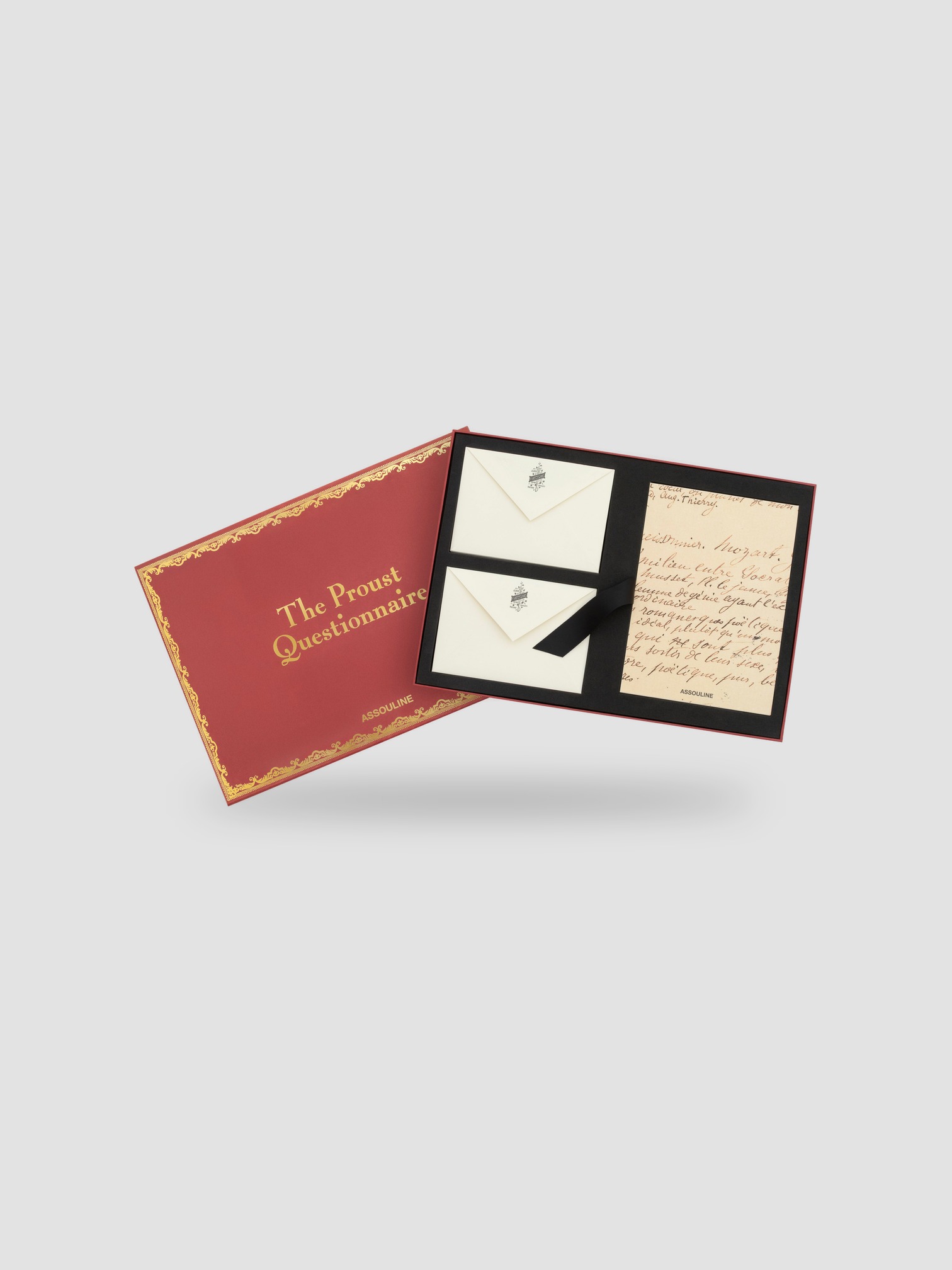 Assouline The World According to Proust Stationery Set in red/gold.