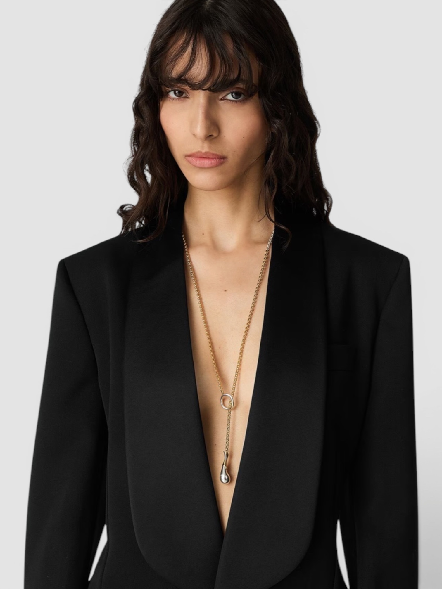 Bottega Veneta Drop Chain Necklace in gold / silver, worn with Phoebe Philo Cotton Wide-Leg Pants, Khaite Mae T-Shirt, Phoebe Philo Pot Cabas Suede and Leather Tote Bag, Alaïa Edge Small Cuff Bracelet. Styled by Sharon Lombardo for FDV Concierge.