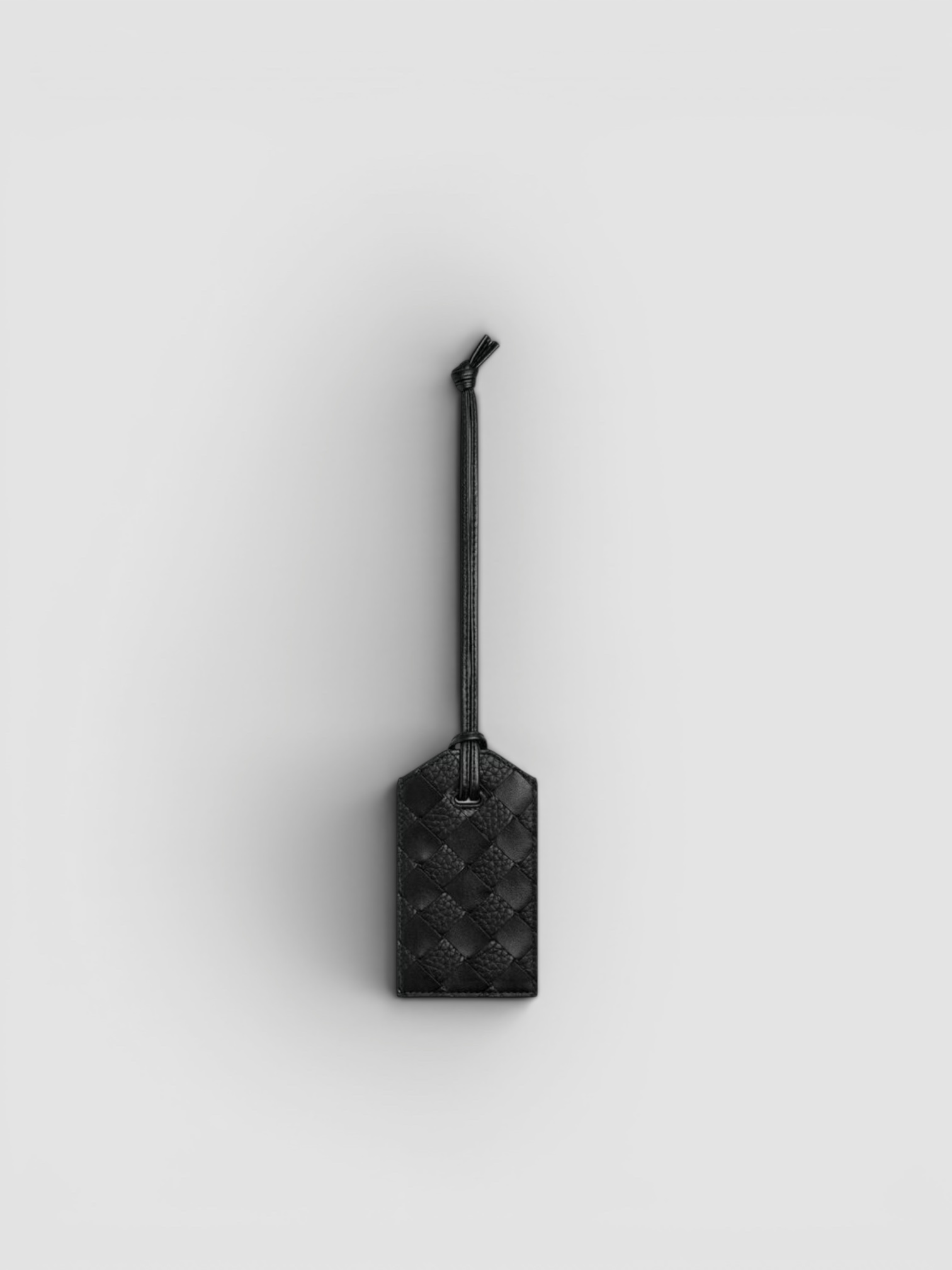 Bottega Veneta Getaway Tag Holder in black.