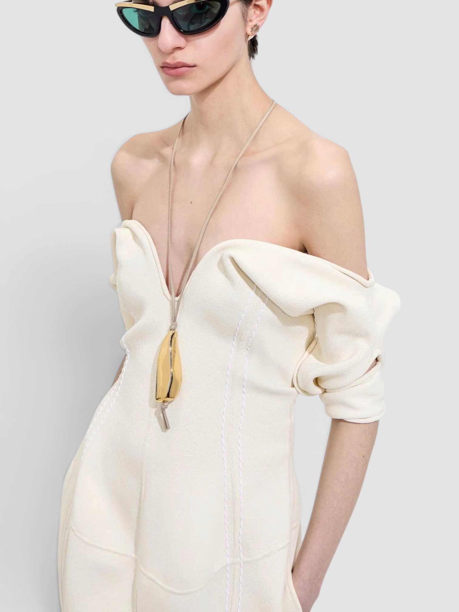 Bottega Veneta Prisma Necklace in gold / leather cord. Styled by Sharon Lombardo for FDV Concierge.