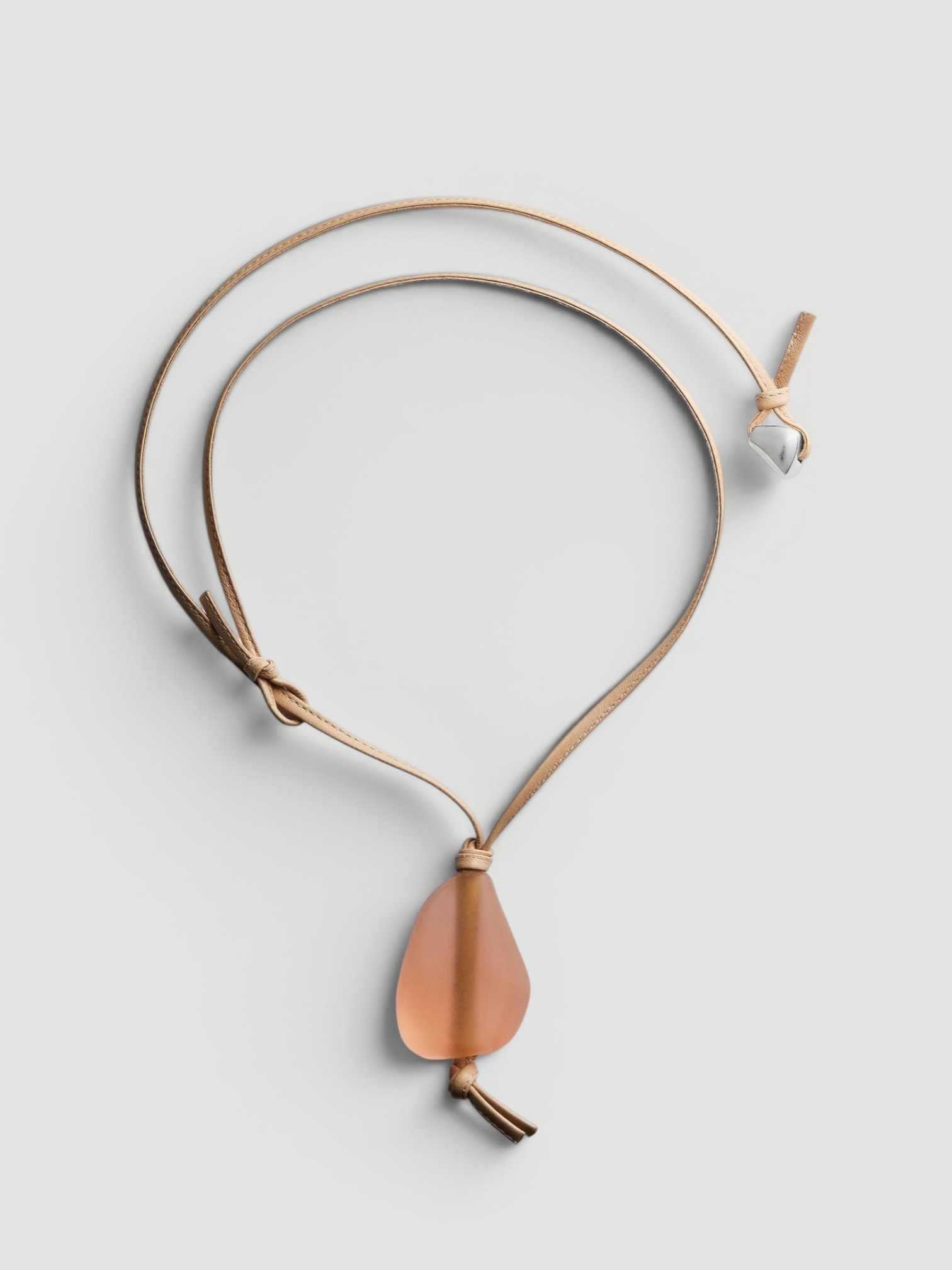 Bottega Veneta Prisma Leather Necklace in peach. Styled by Sharon Lombardo for FDV Concierge.