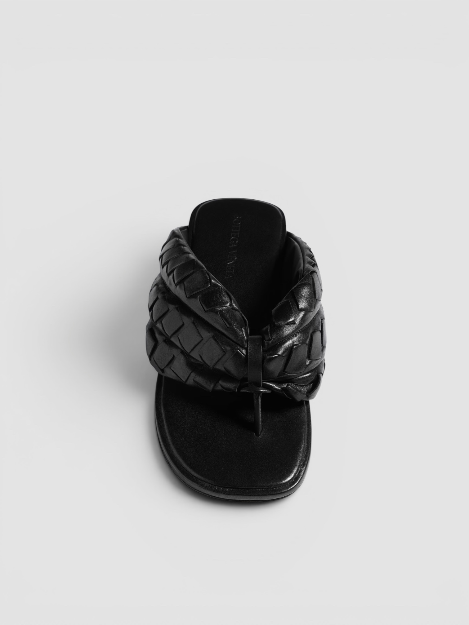 Bottega Veneta Salsa Flat Thong in black, worn with SSSTEIN Skipper Cotton Shirt, Dries Van Noten Printed Cotton-Blend Wide-Leg Pants, Phoebe Philo Small Stud Cabas Tote Bag, Bottega Veneta Cat-Eye Acetate Sunglasses, the day. Styled by Sharon Lombardo for FDV Concierge.