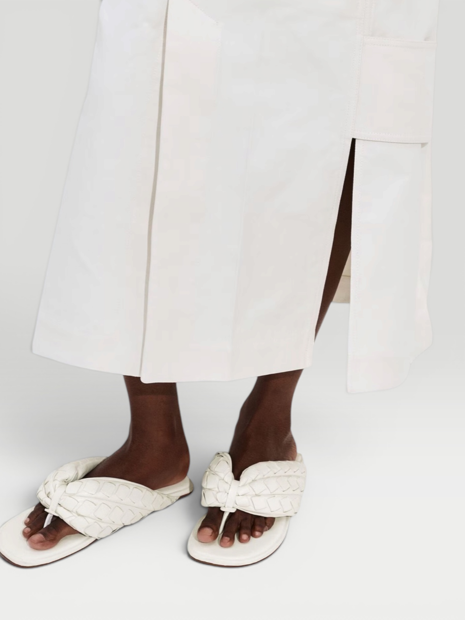 Bottega Veneta Salsa Flat Thong in white, worn with HEIRLOME Monica Dress. Styled by Sharon Lombardo for FDV Concierge.