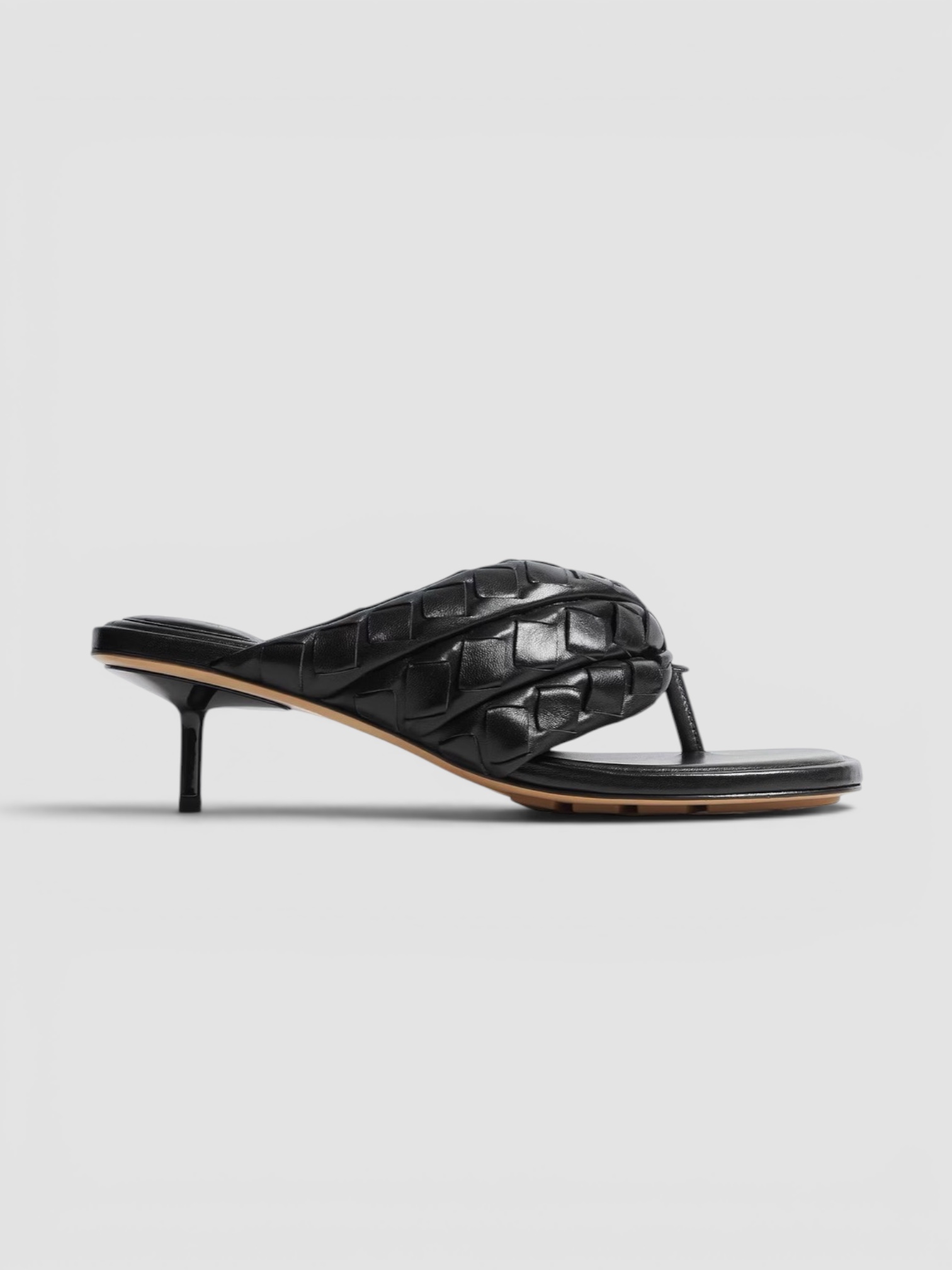 Bottega Veneta Salsa Thong in black, worn with Toteme Lyocell-Blend Tapered Pants, Róhe Off Shoulder Lapel Top, Phoebe Philo Gig Leather Shoulder Bag, Phoebe Philo Bombe Sunglasses, the evening. Styled by Sharon Lombardo for FDV Concierge.