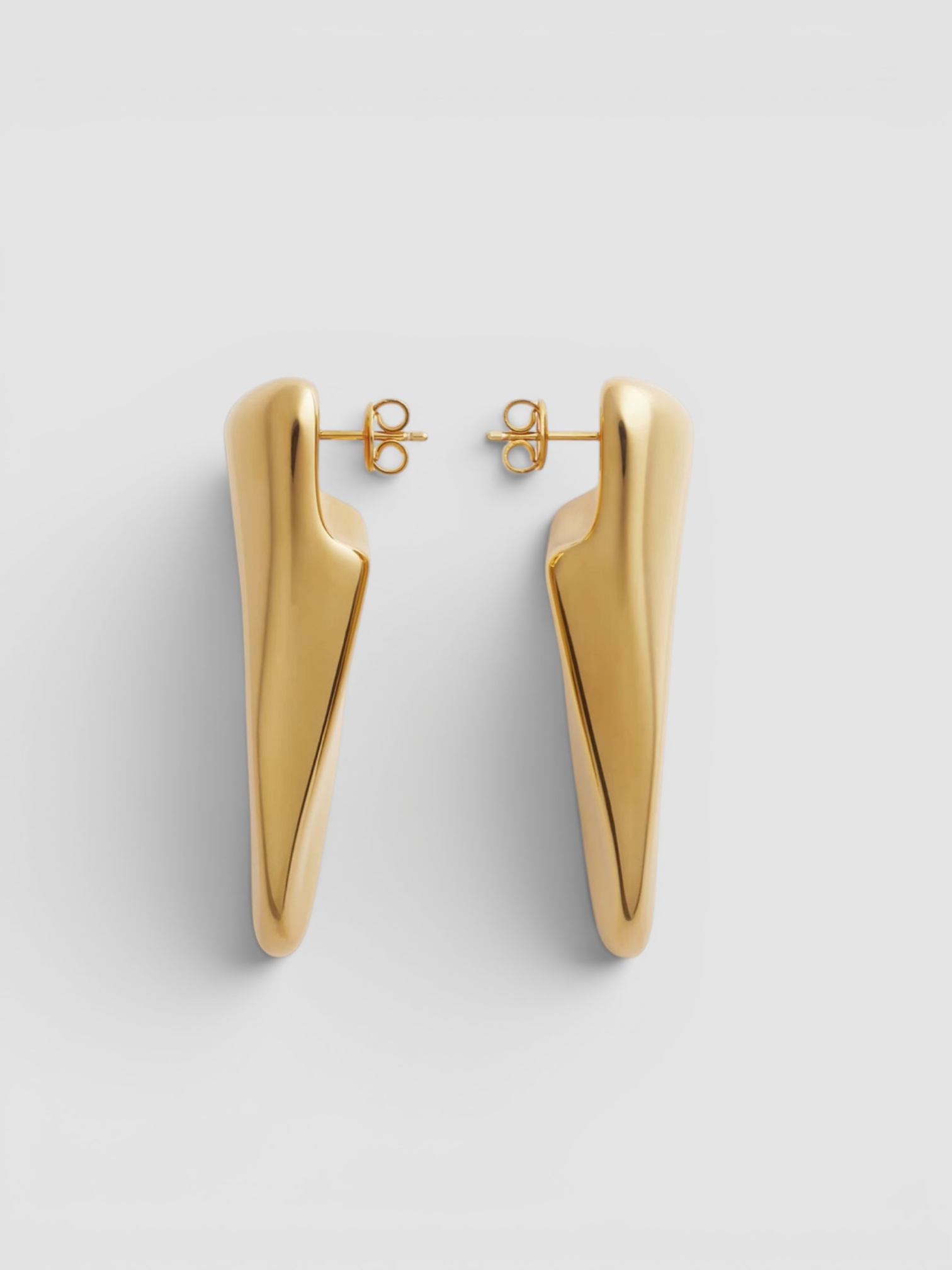 Bottega Veneta Large Prisma Earrings in yellow gold. Styled by Sharon Lombardo for FDV Concierge.