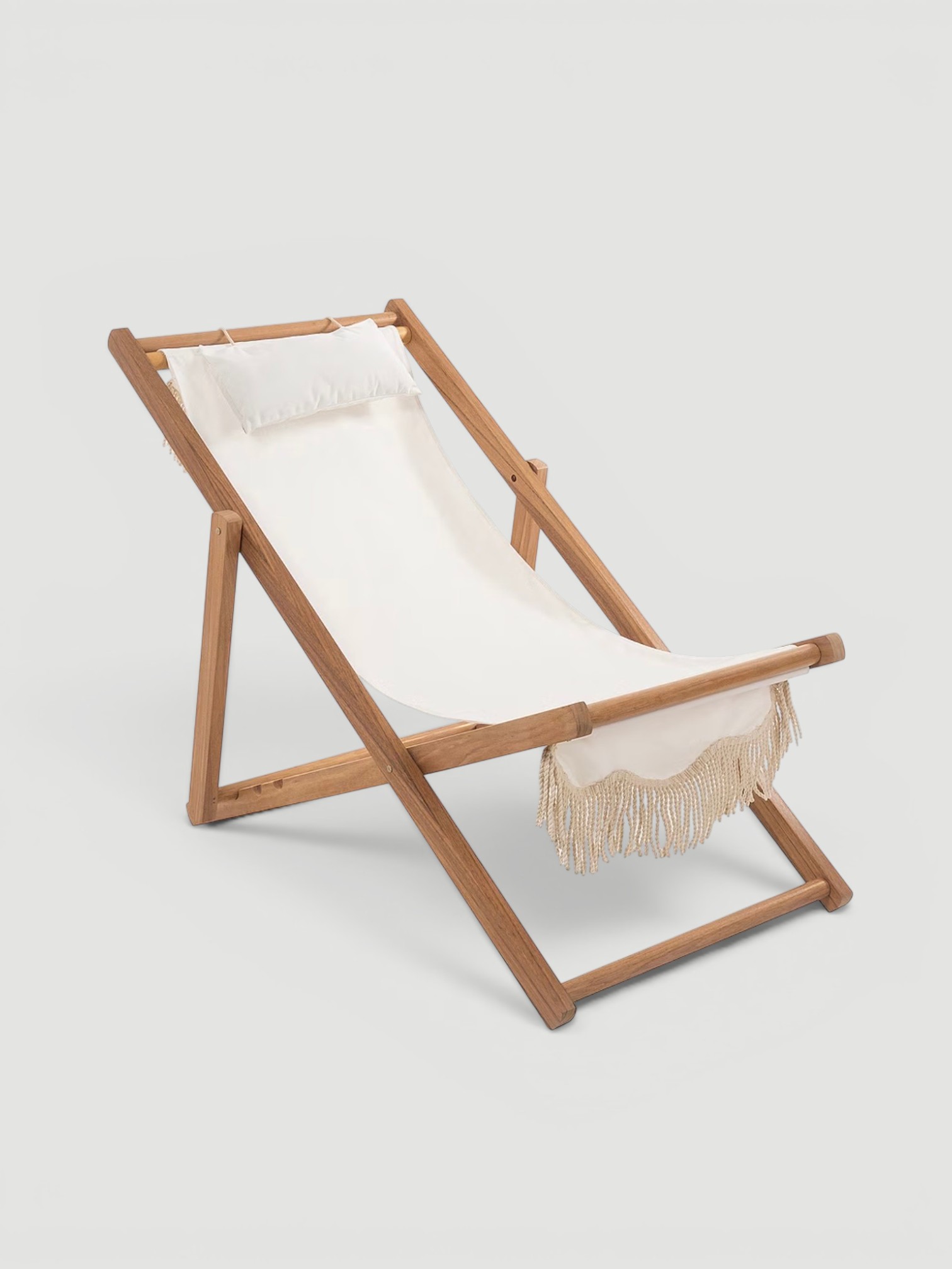 Business & Pleasure Co. Premium Fringed Canvas Sling Chair in white.