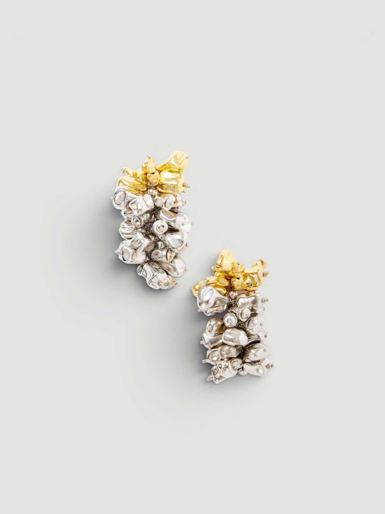 Dries Van Noten Silver and Gold-Tone Cluster Earrings in silver. Styled by Sharon Lombardo for FDV Concierge.