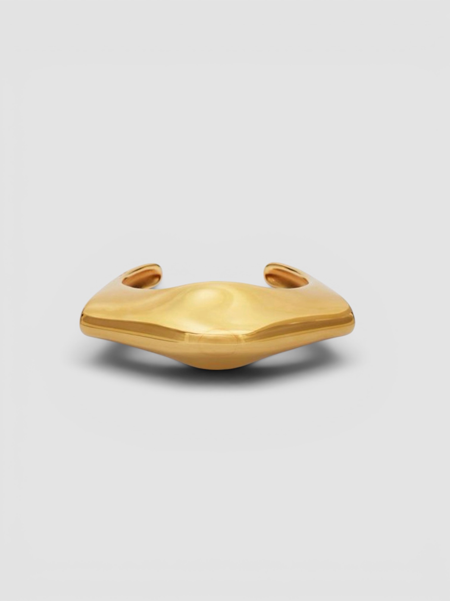 Khaite Lotus 18kt Gold-Plated Cuff Bracelet in gold. Styled by Sharon Lombardo for FDV Concierge.