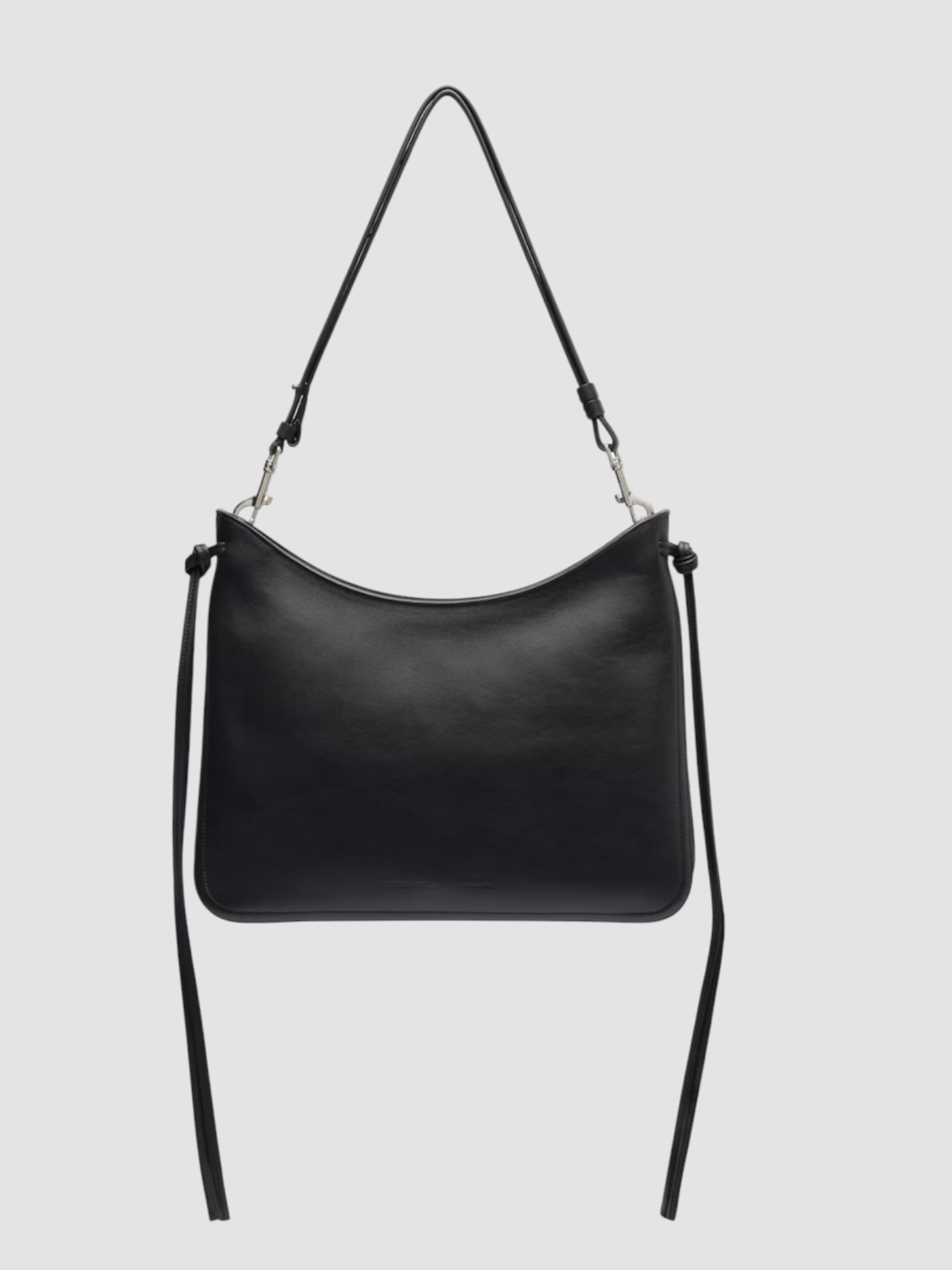 Phoebe Philo Gig Leather Shoulder Bag in black silver, worn with Toteme Lyocell-Blend Tapered Pants, Róhe Off Shoulder Lapel Top, Bottega Veneta Salsa Thong, Phoebe Philo Bombe Sunglasses, the evening. Styled by Sharon Lombardo for FDV Concierge.