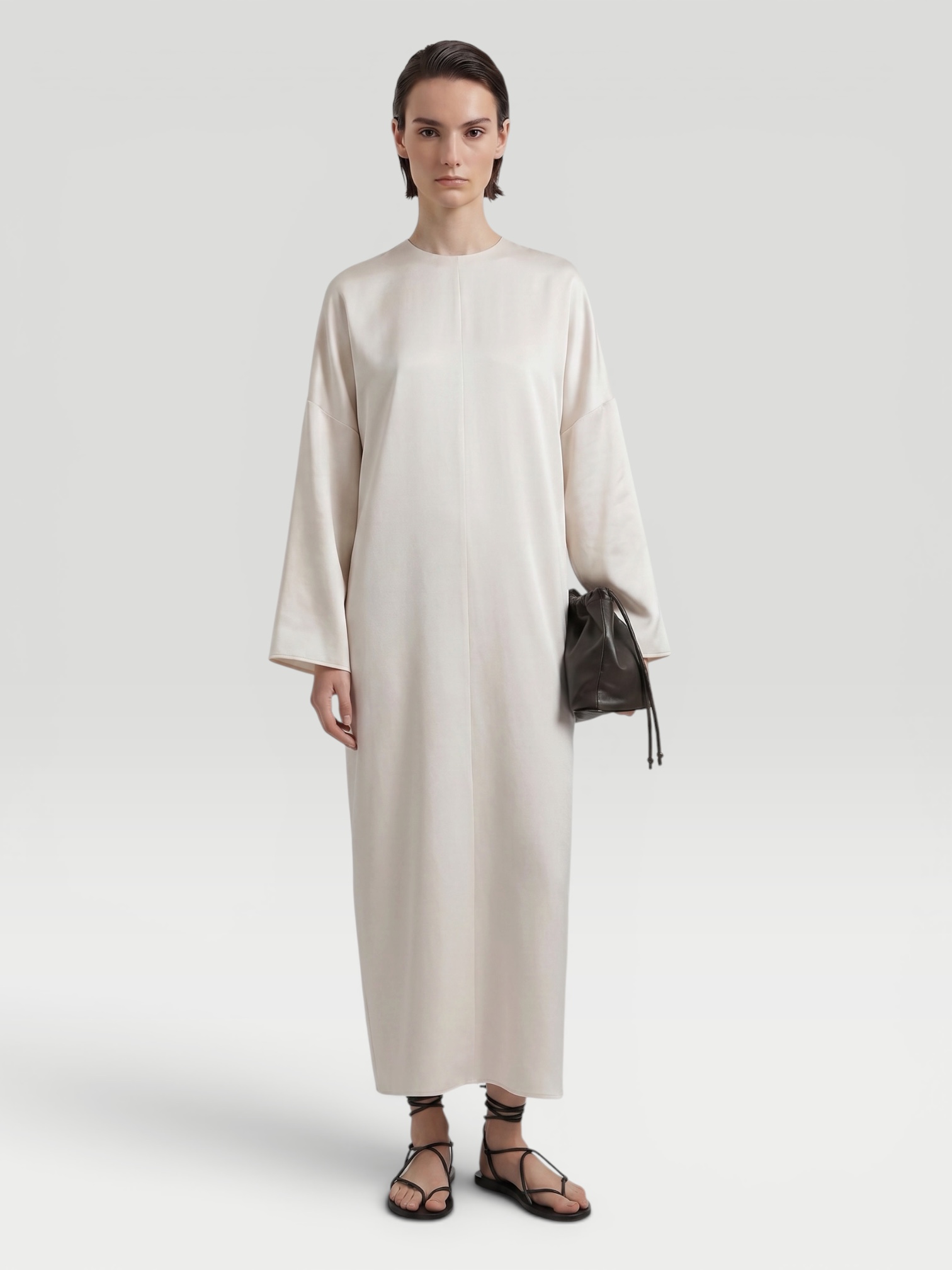 A.Emery The Sisco Dress in oyster, worn with Bottega Veneta Salsa Thong. Styled by Sharon Lombardo for FDV Concierge.