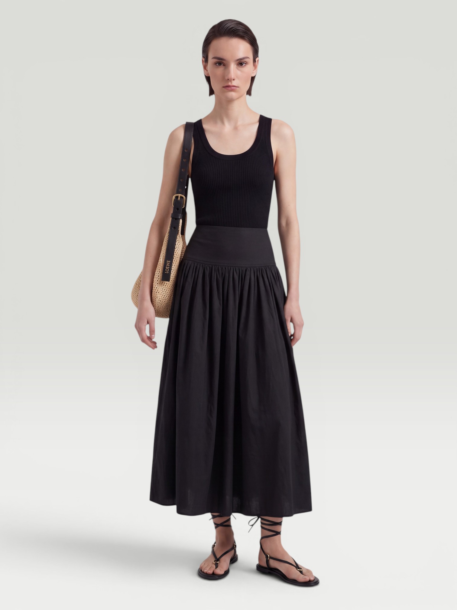 Alaïa Cotton Midi Skirt in black. Styled by Sharon Lombardo for FDV Concierge.