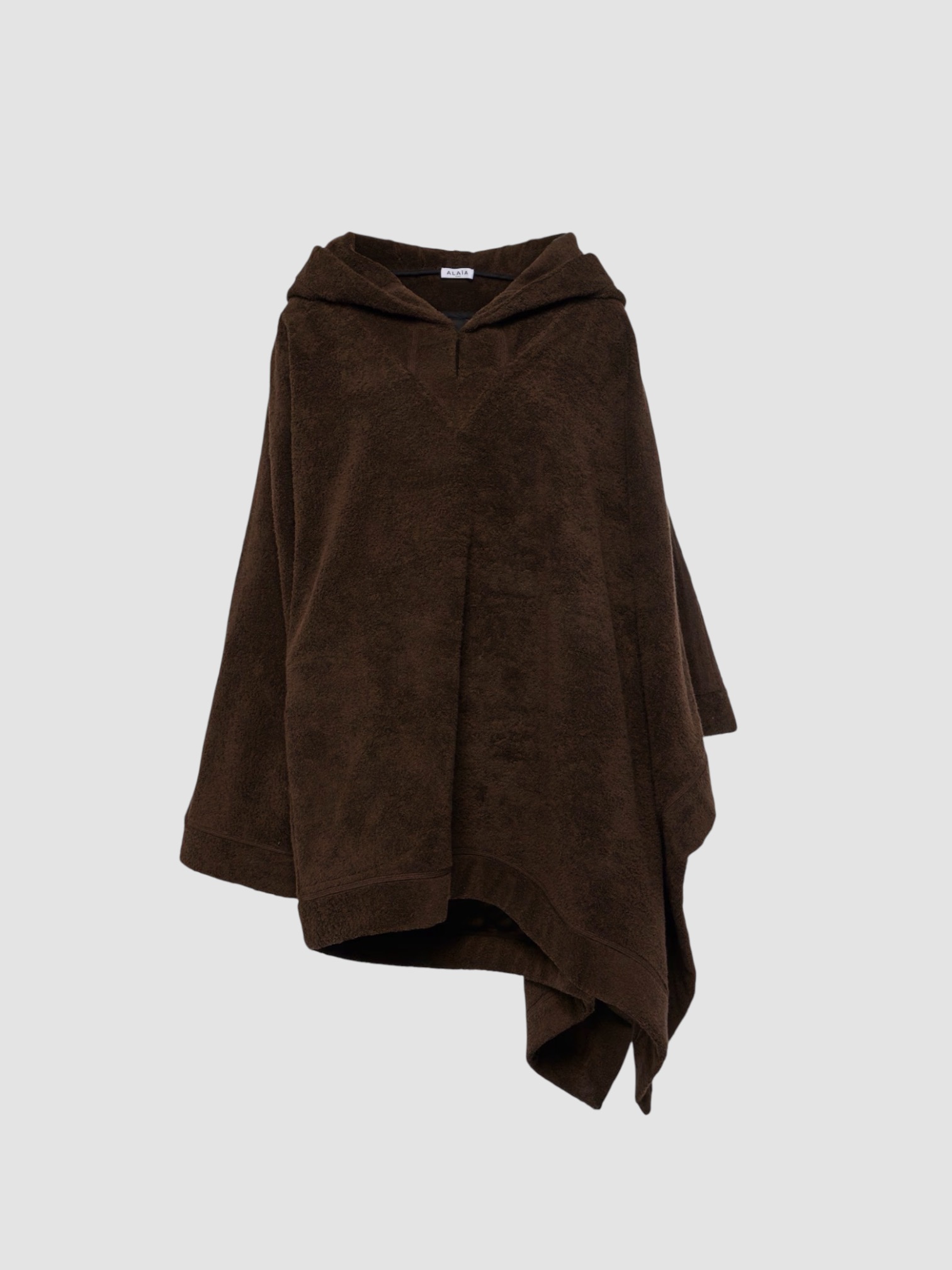 Alaïa Cotton Terry Hoodie in cafe. Styled by Sharon Lombardo for FDV Concierge.
