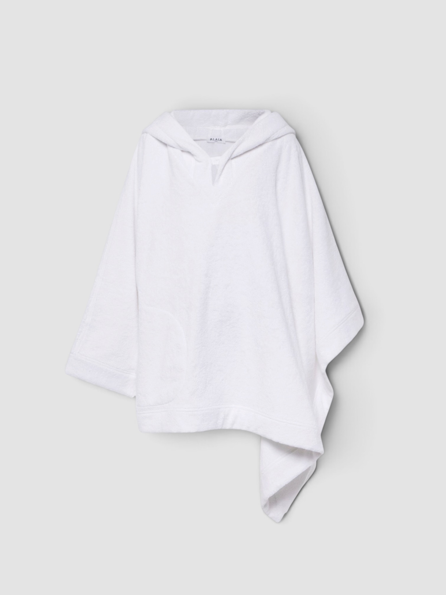 Alaïa Cropped Cotton Terry Hoodie in blanc. Styled by Sharon Lombardo for FDV Concierge.