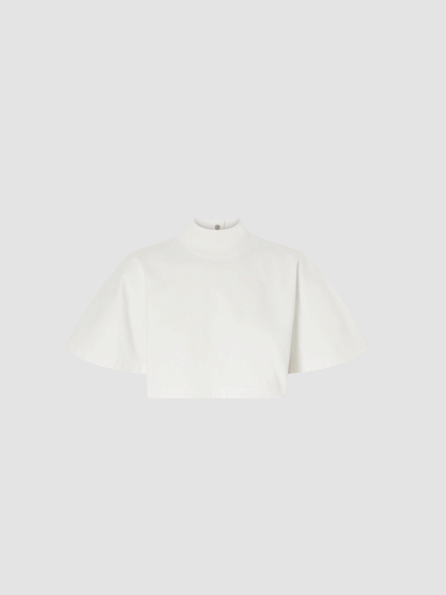 Alaïa Cropped Jersey Turtleneck Tee in white, worn with Alaïa Balloon Pants, Alaïa Wedge Thong Mule. Styled by Sharon Lombardo for FDV Concierge.