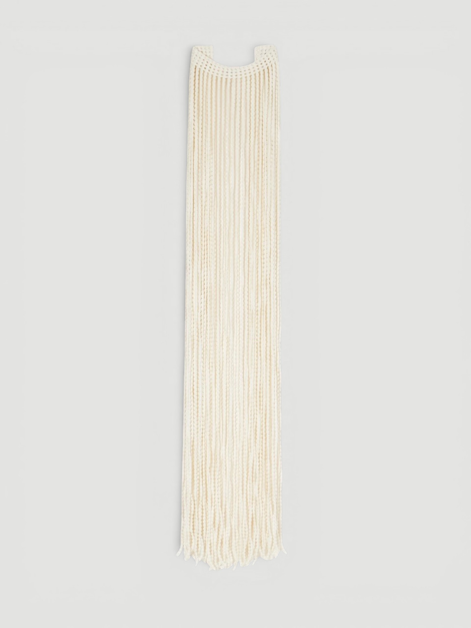 Alaïa Fringed Crocheted Scarf in cream.