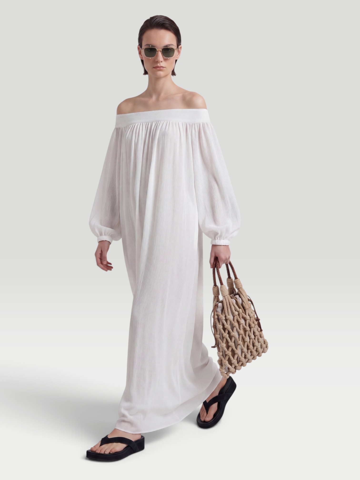 Alaïa Off-Shoulder Maxi Dress in white. Styled by Sharon Lombardo for FDV Concierge.