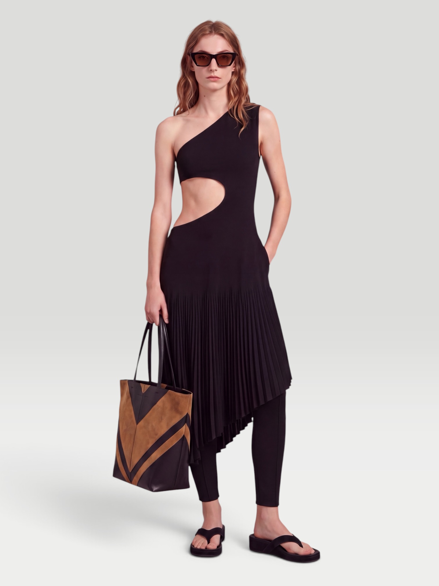 Alaïa One-Shoulder Cutout Midi Dress in black. Styled by Sharon Lombardo for FDV Concierge.