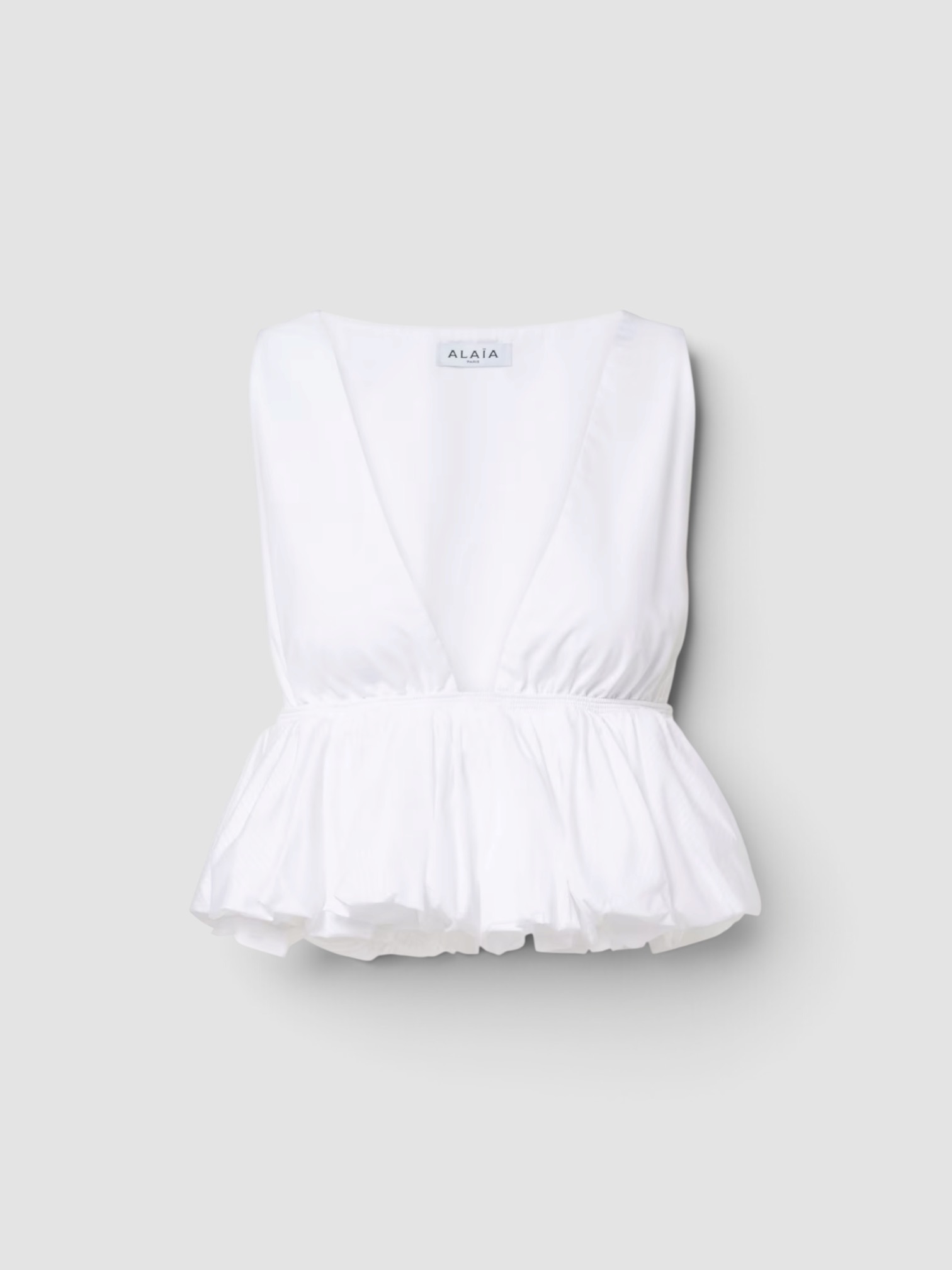 Alaïa Peplum Cotton Top in blank. Styled by Sharon Lombardo for FDV Concierge.