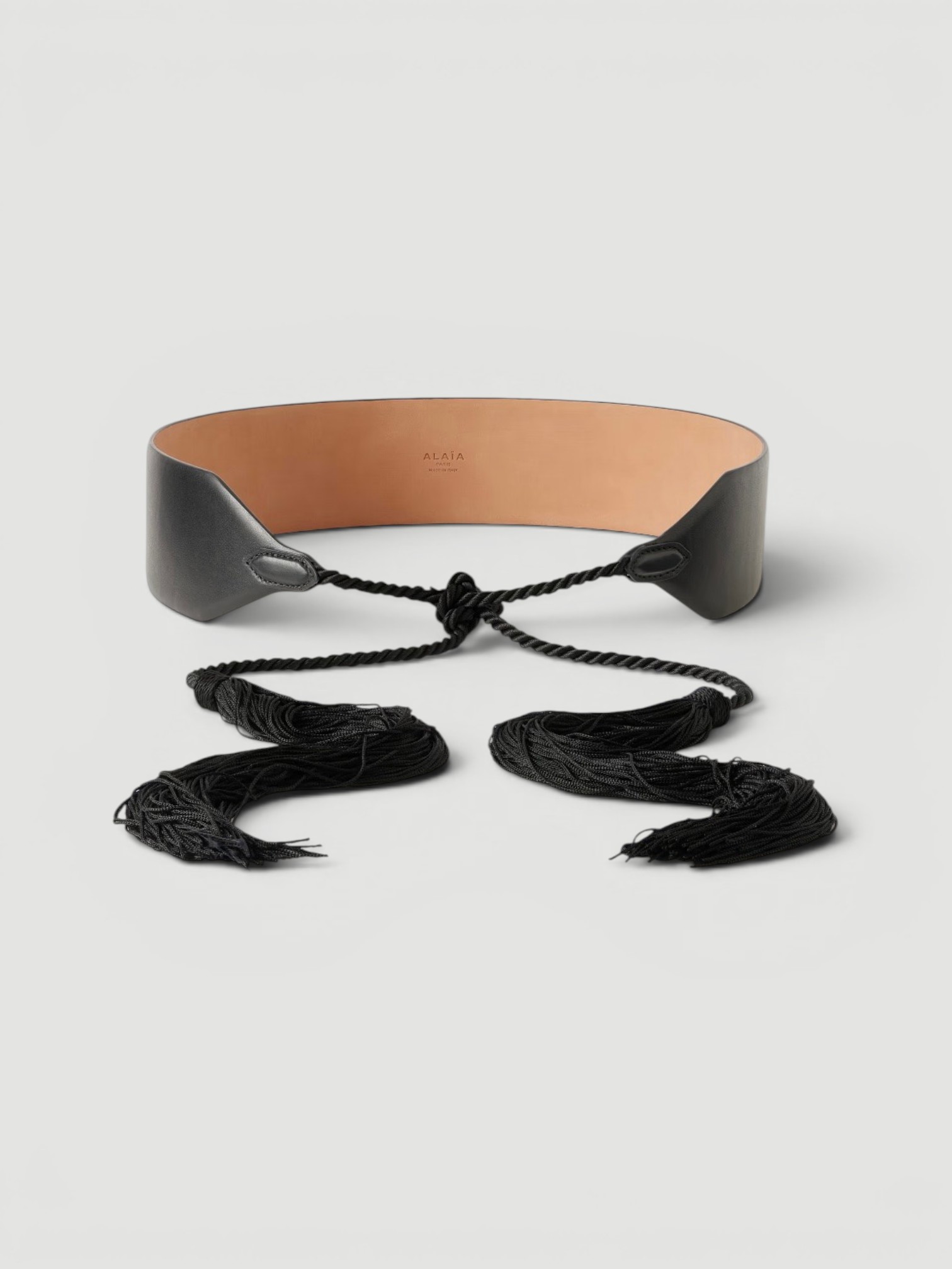 Alaïa Tasseled Leather Belt in black.
