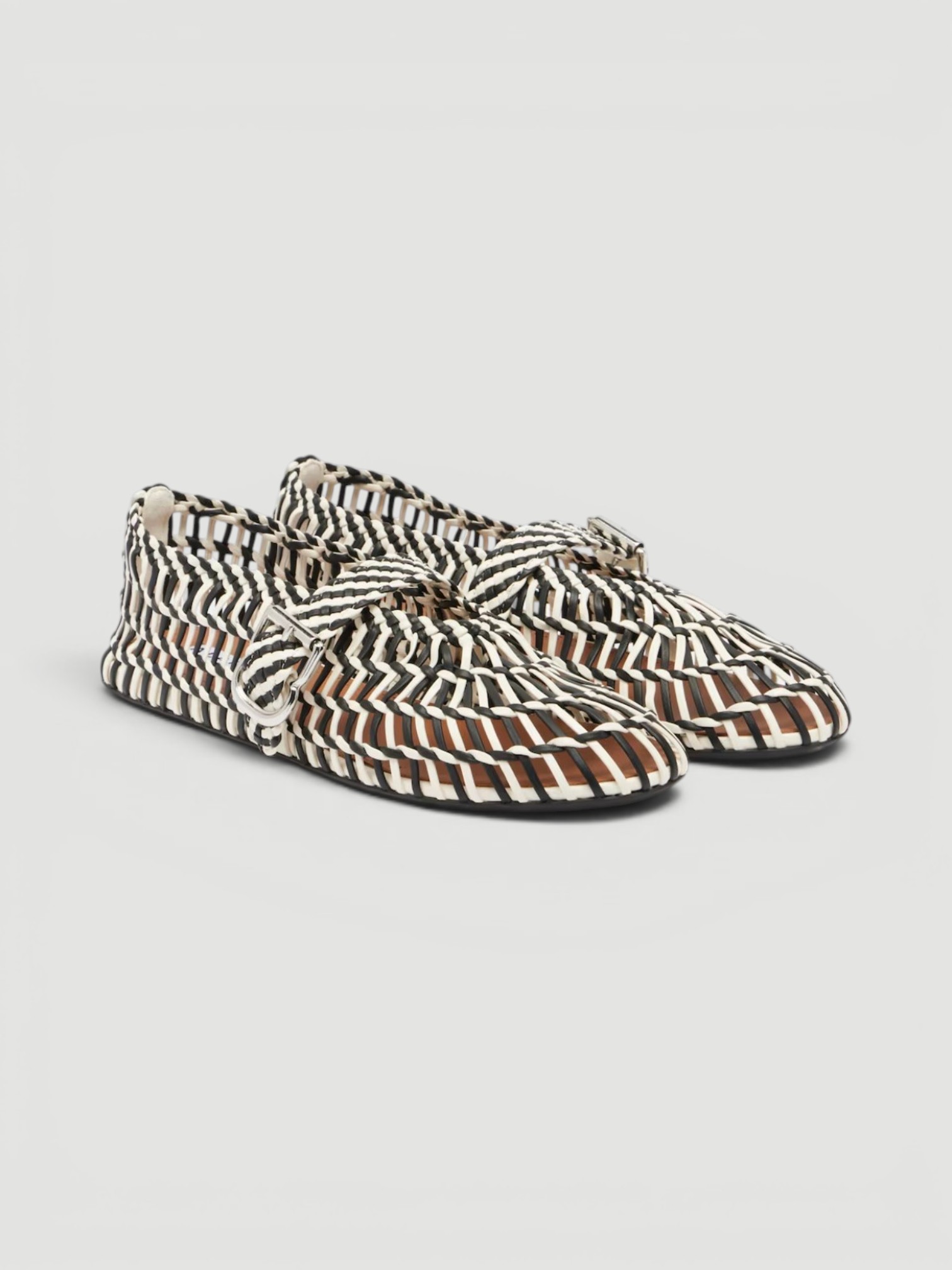 Alaïa Woven Leather Ballet Flats in noir/blanc.