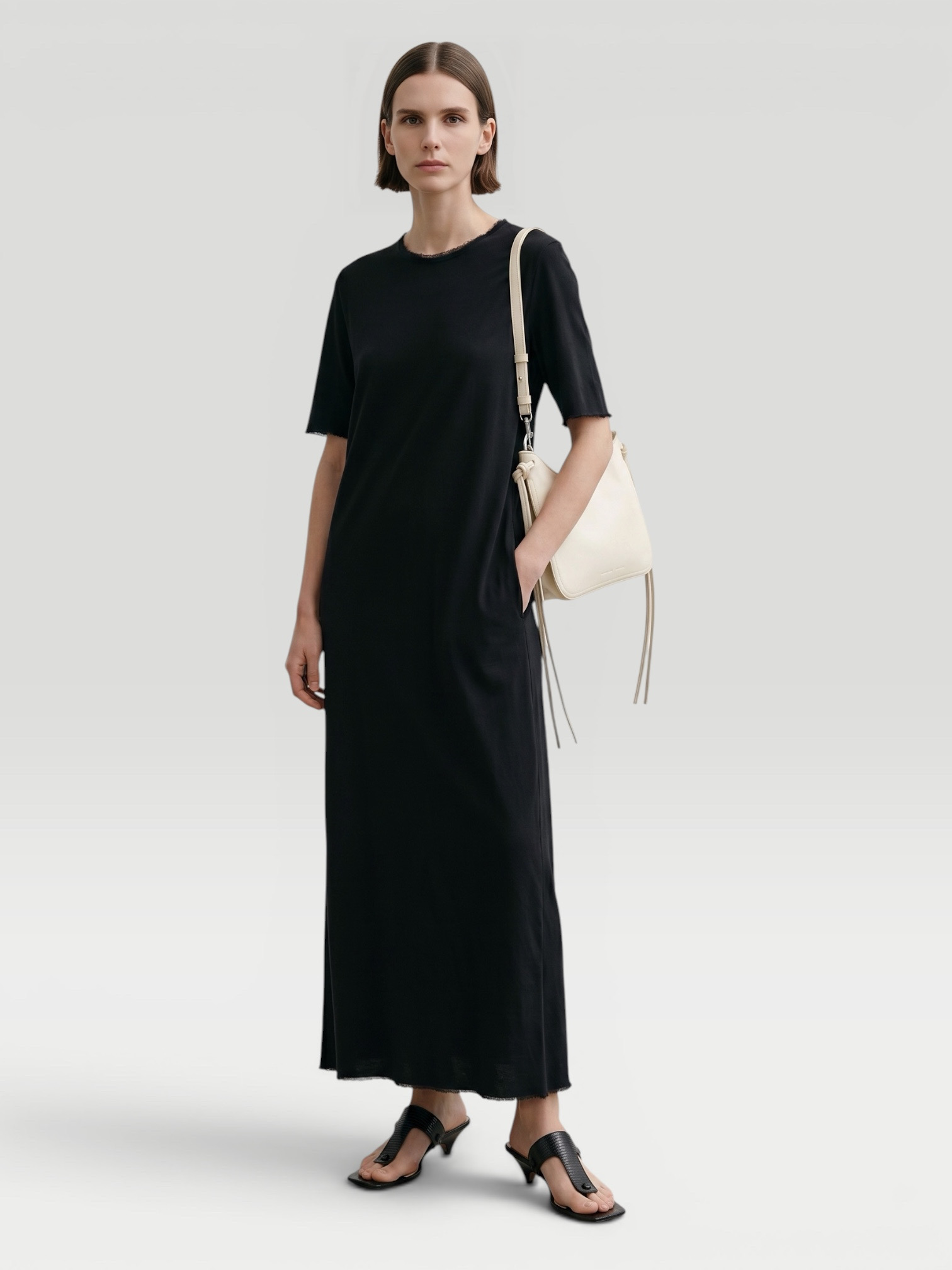 All Three Amara Gauze Maxi Dress in black, worn with A.EMERY Kinto Flip Flops. Styled by Sharon Lombardo for FDV Concierge.