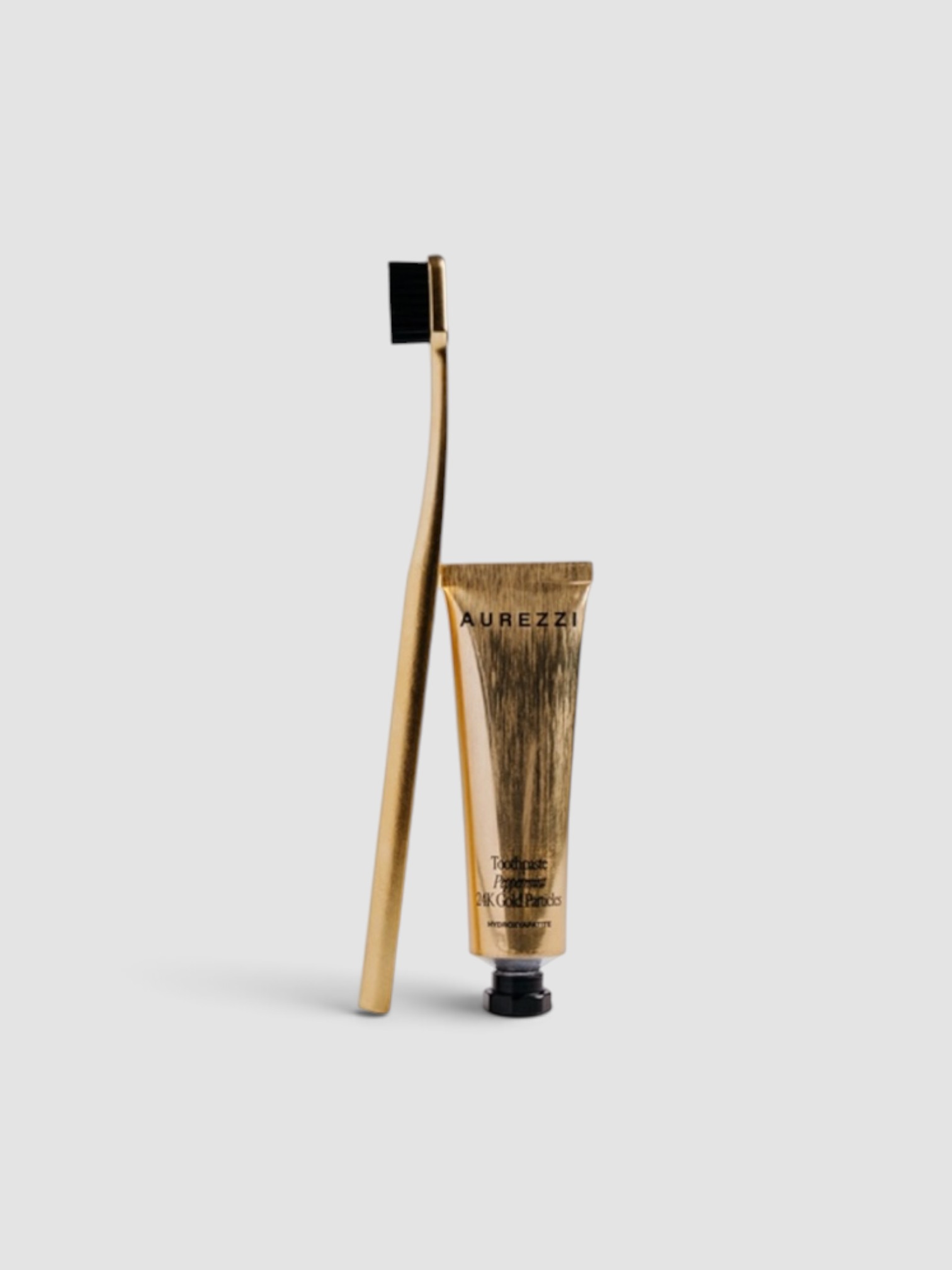 Aurezzi Travel Mini Gold in gold / black bristles.
