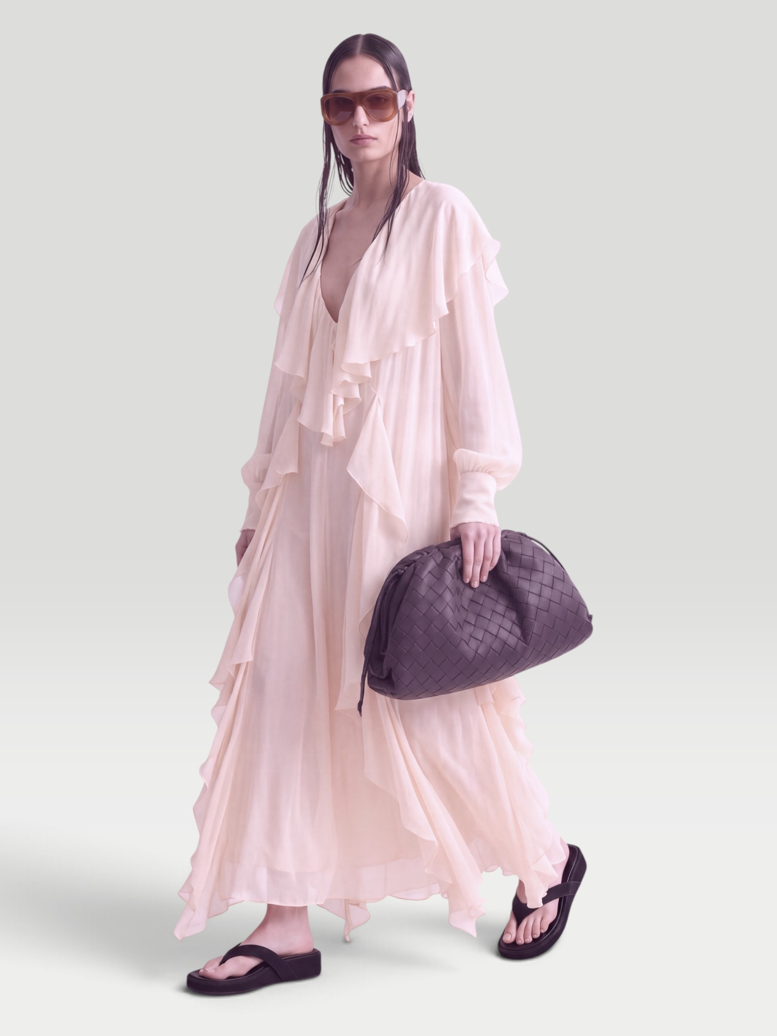 Blumarine Ruffled Maxi Dress in beige, worn with Phoebe Philo Frizz Flip Flop. Styled by Sharon Lombardo for FDV Concierge.
