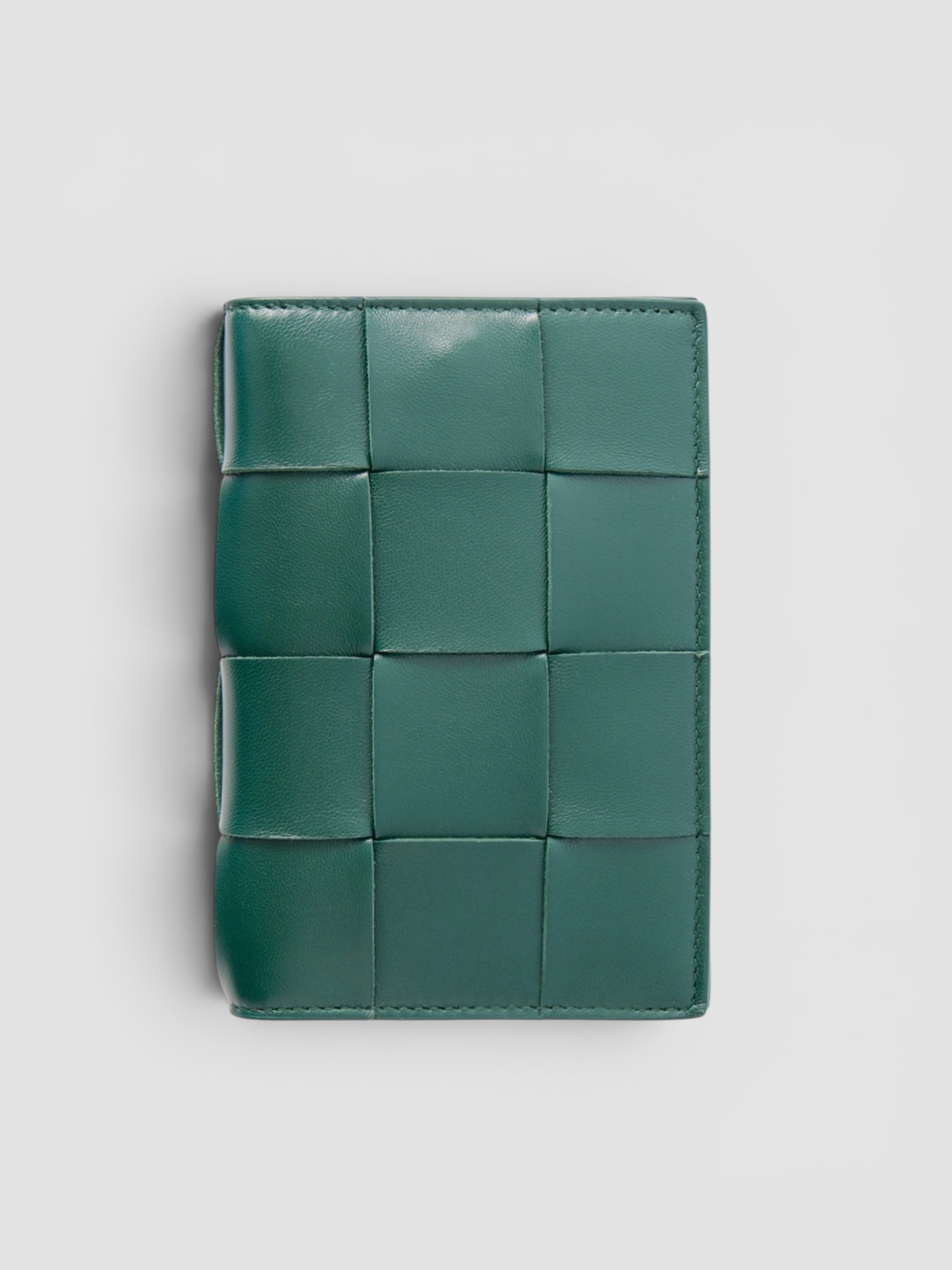 Bottega Veneta Cassette Intrecciato Passport Case in green.