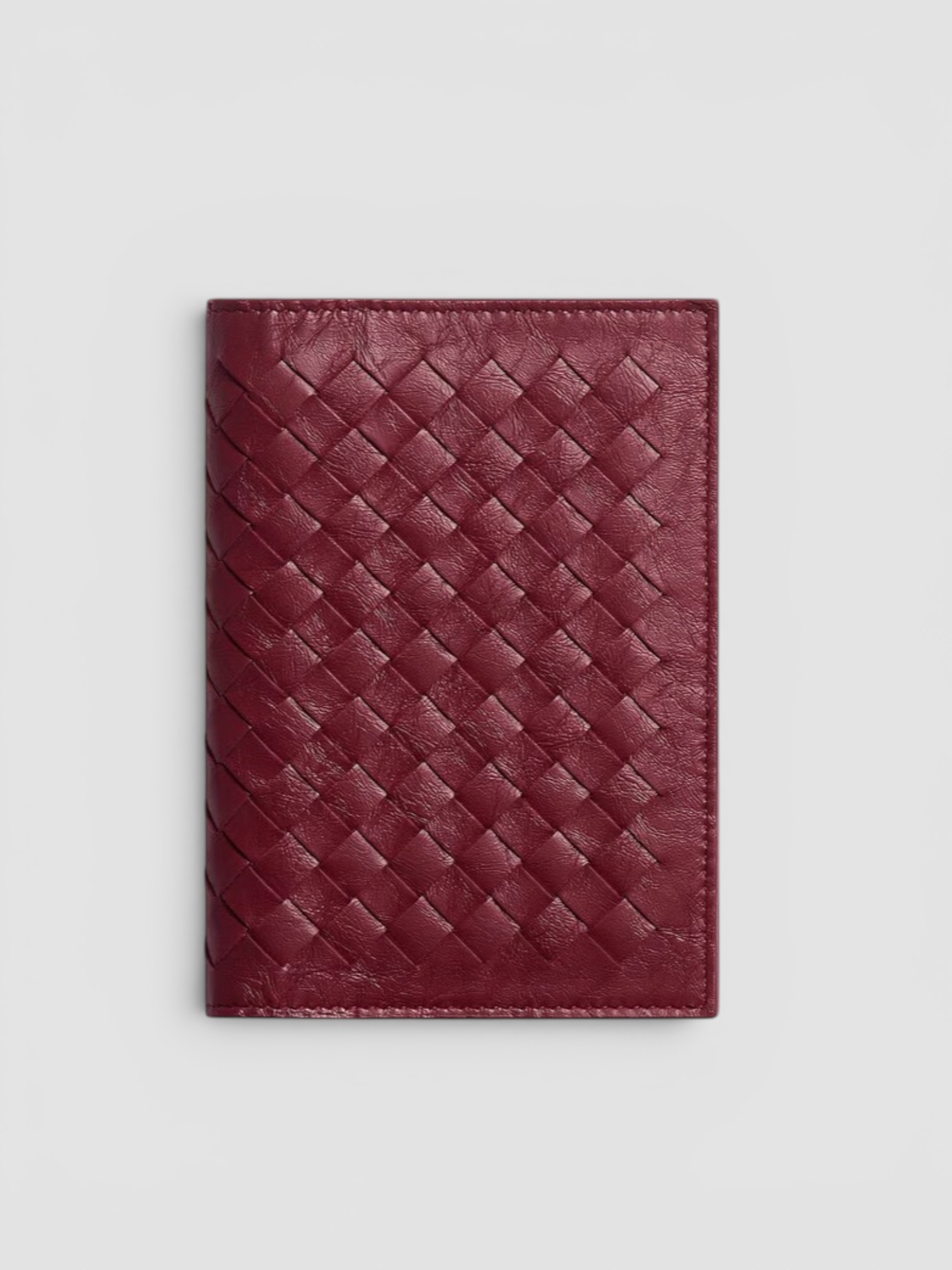 Bottega Veneta Woven Mycelium Passport Case in bordeaux.