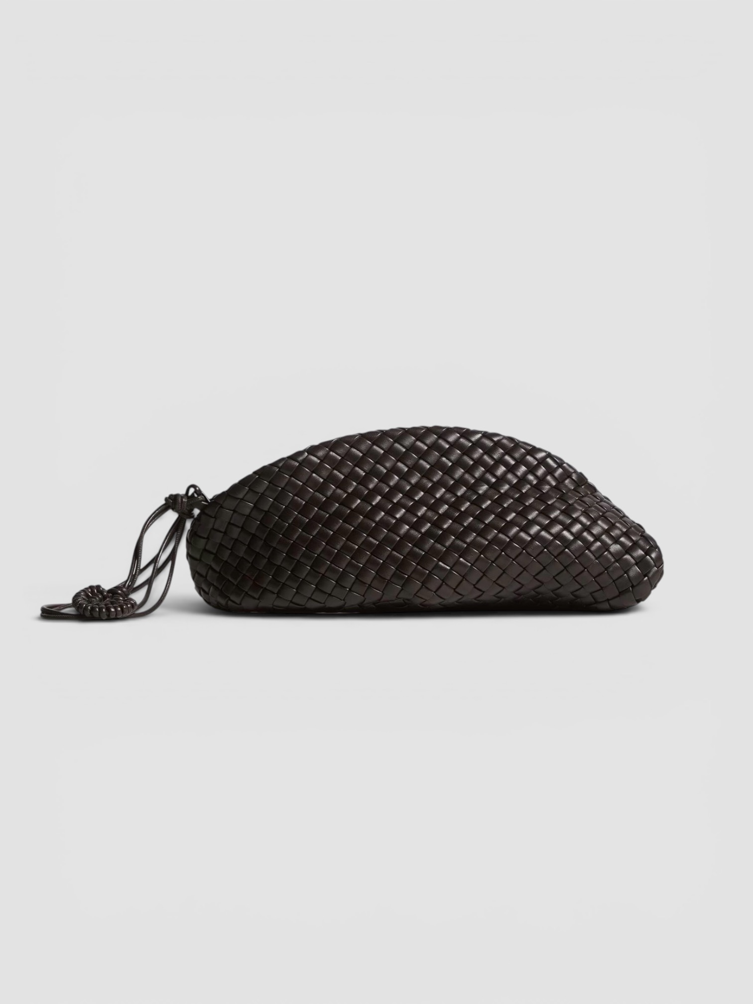 Bottega Veneta Small Onda Clutch in black, worn with St. Agni Soft Jersey Slim Scoop Tank, Phoebe Philo Straight Jeans, Phoebe Philo Cone Heel Mules, Phoebe Philo 25mm Leather Belt, the evening. Styled by Sharon Lombardo for FDV Concierge.