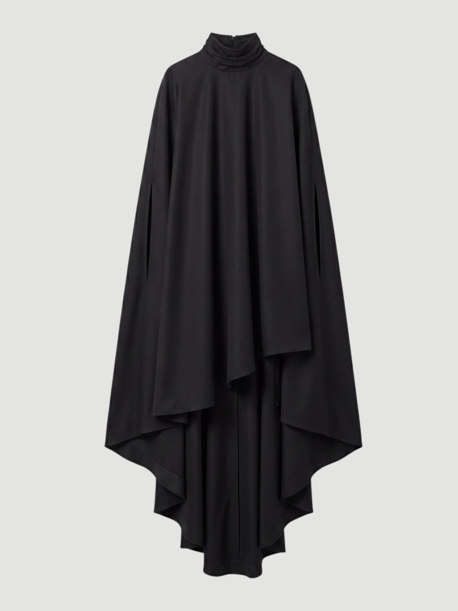Bottega Veneta Light Wool Kaftan Dress in black, worn with Loewe Shell Small Leather Bucket Bag. Styled by Sharon Lombardo for FDV Concierge.