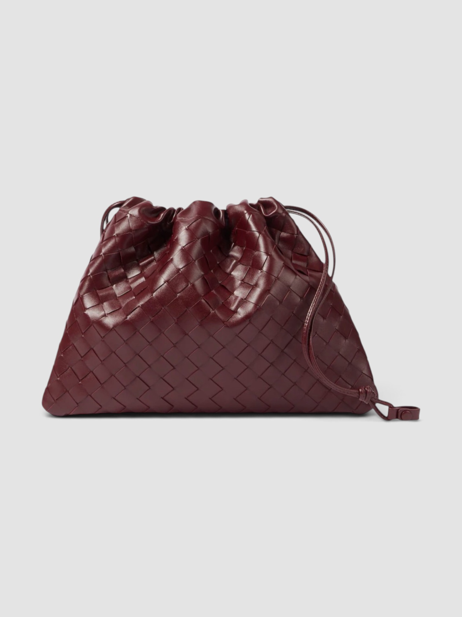 Bottega Veneta Dustbag Medium Leather Clutch in burgundy, worn with FIL DE VIE Isadora Dress. Styled by Sharon Lombardo for FDV Concierge.