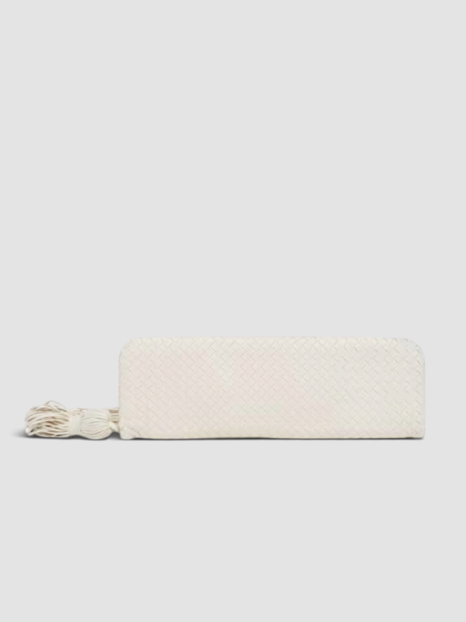 Bottega Veneta Tassel Nappa Leather Clutch Bag in alabaster, worn with FIL DE VIE Isadora Dress. Styled by Sharon Lombardo for FDV Concierge.