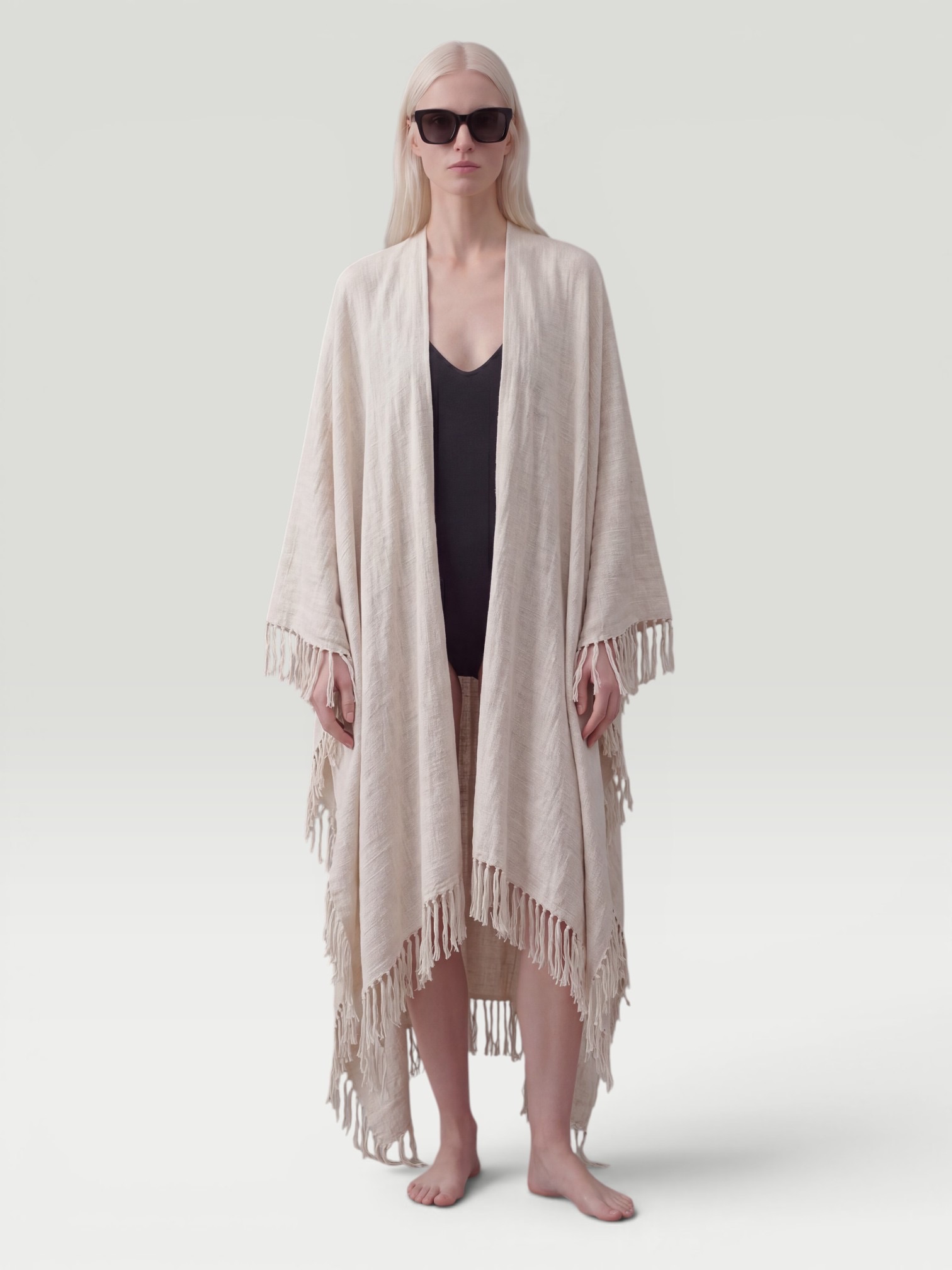 Brunello Cucinelli Fringed Linen Blend Scarf in neutral. Styled by Sharon Lombardo for FDV Concierge.