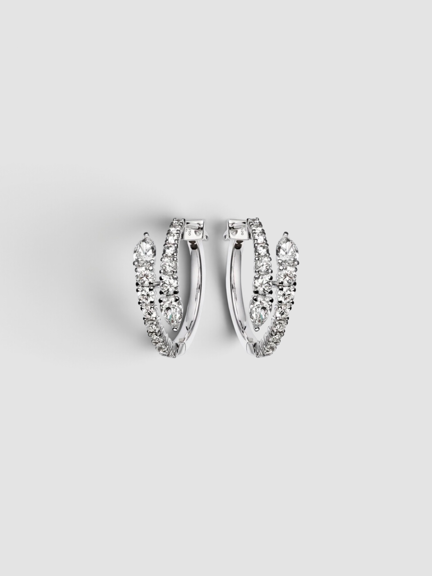 Bucherer Fine Jewellery Diamond Twist Earrings in silver.