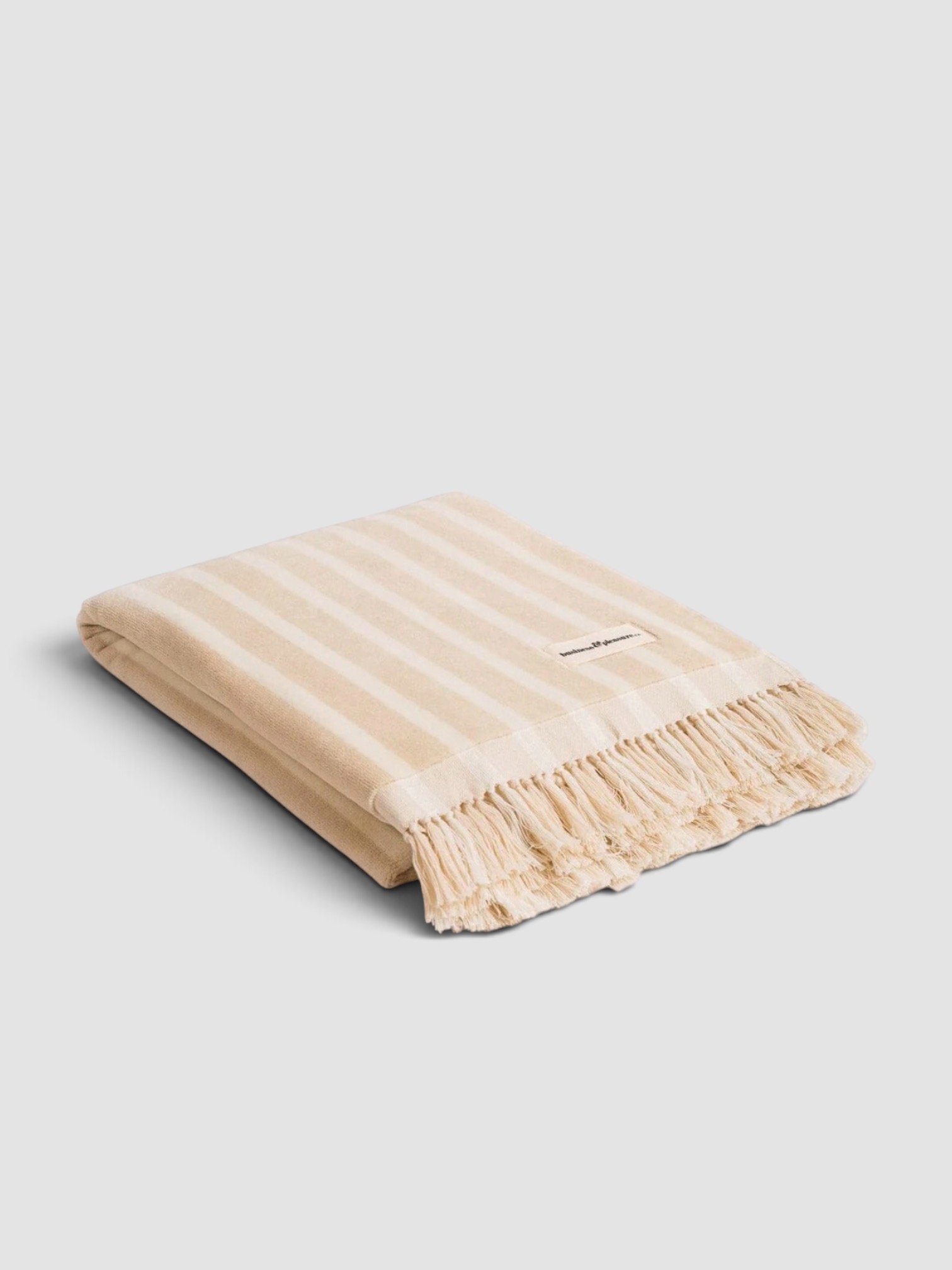 Business & Pleasure Co. Beach Towel in Beige Stripe in beige stripe.