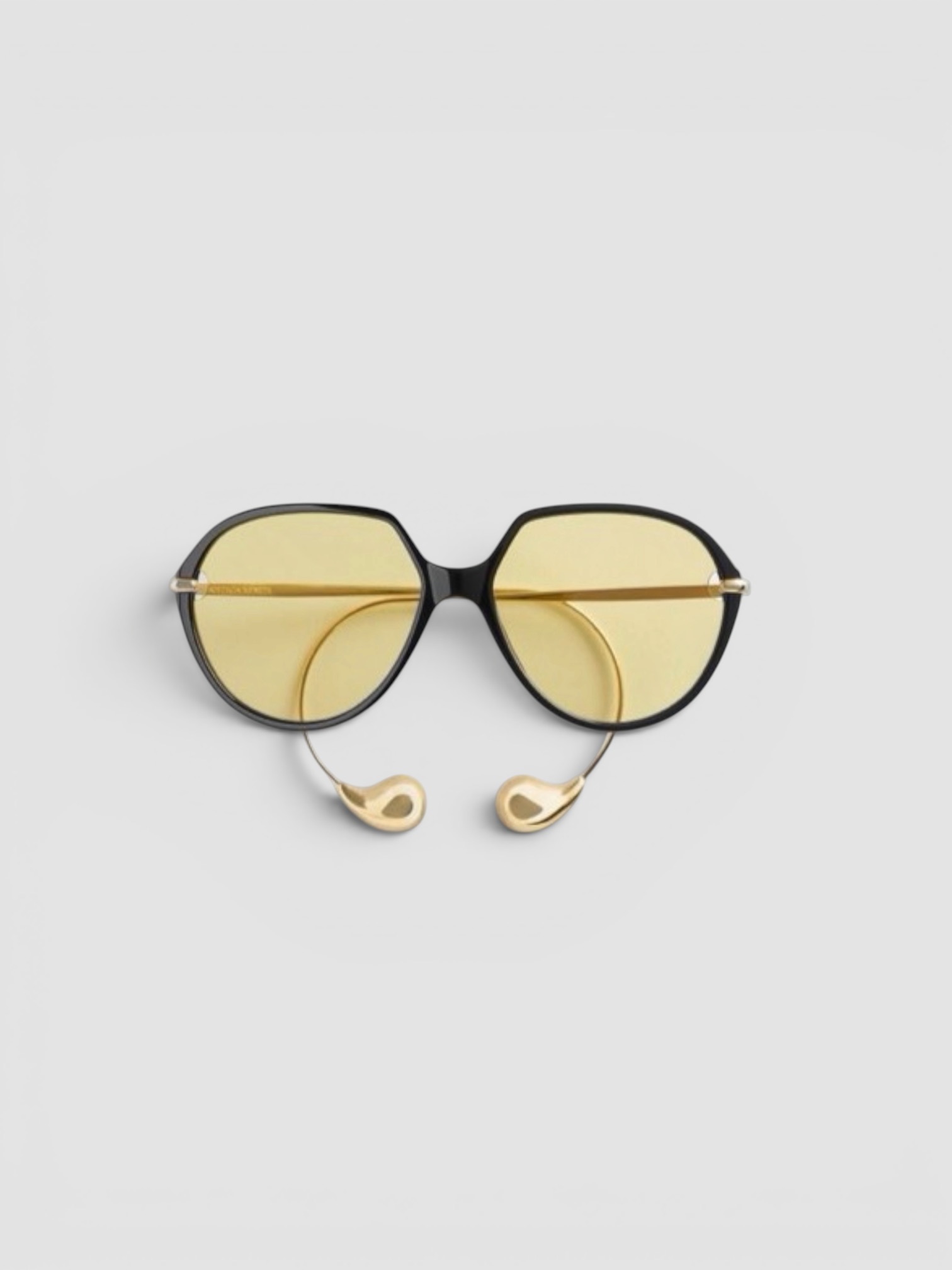 Bottega Veneta Drop Squared Sunglasses in black/yellow, worn with Jacquemus Cuadro Asymmetric Striped Cotton Shirt, R13 Cuffed X-Boyfriend Jeans. Styled by Sharon Lombardo for FDV Concierge.