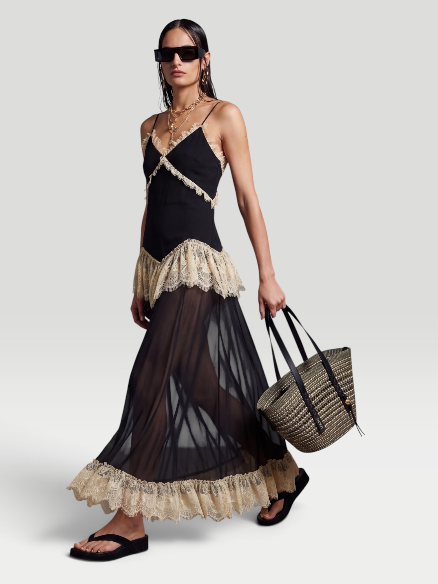 De La Vali Estela Lace-Trimmed Georgette Maxi Dress in black. Styled by Sharon Lombardo for FDV Concierge.