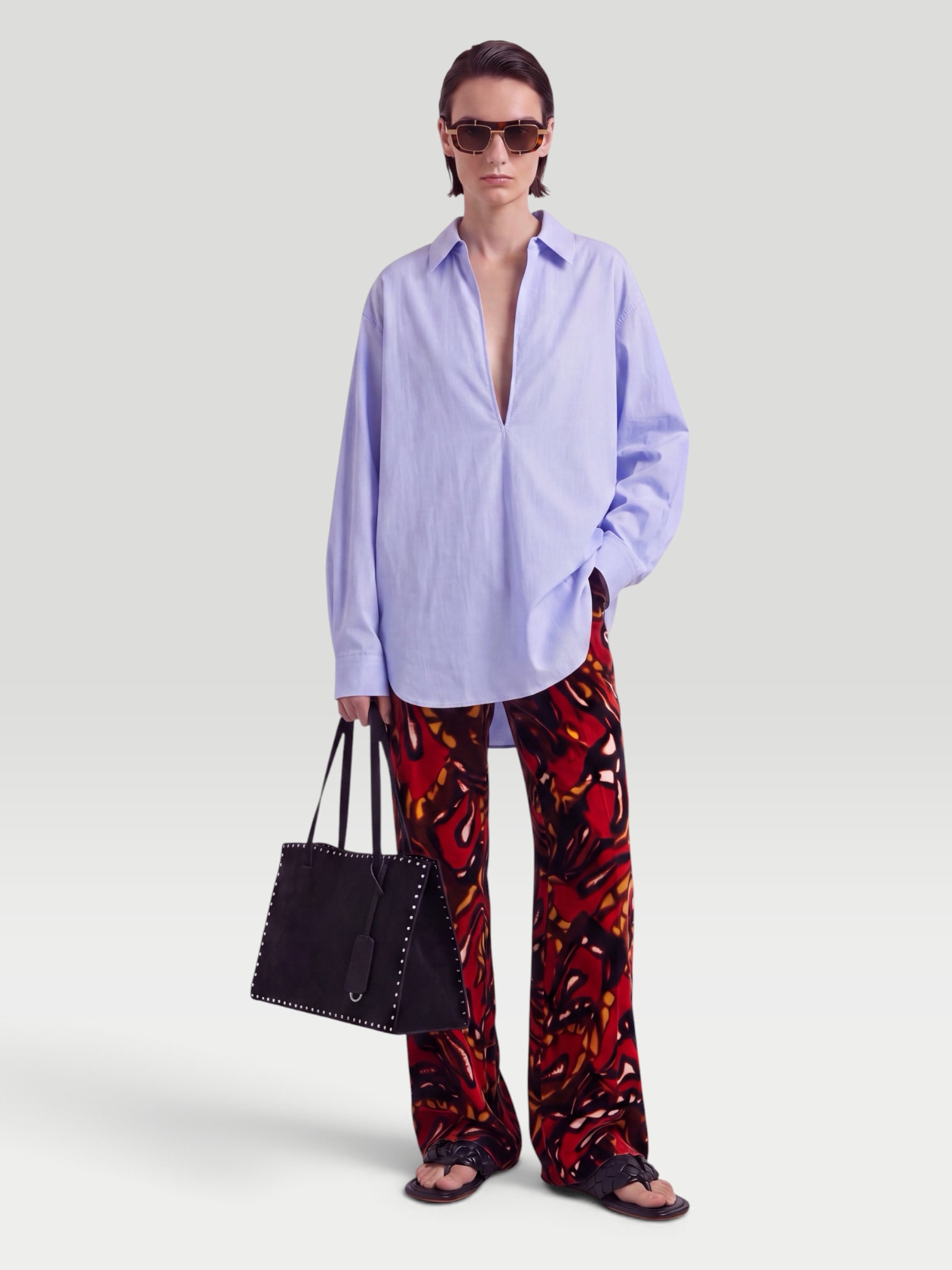 Dries Van Noten Printed Cotton-Blend Wide-Leg Pants in rust multi, worn with SSSTEIN Skipper Cotton Shirt, Bottega Veneta Salsa Flat Thong, Phoebe Philo Small Stud Cabas Tote Bag, Bottega Veneta Cat-Eye Acetate Sunglasses, the day. Styled by Sharon Lombardo for FDV Concierge.