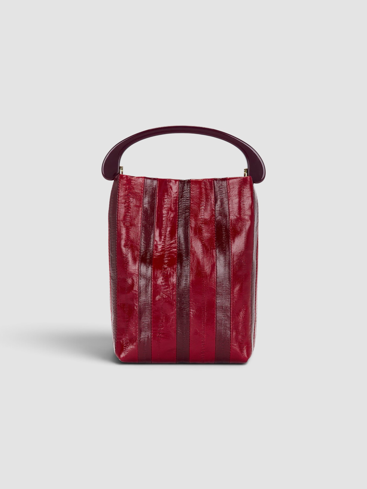 Dries Van Noten Crisp Bag in red, worn with Dries Van Noten Floral Shirt Dress, Bottega Veneta Sampieri Flat Thong, Bottega Veneta Cat-Eye Acetate Sunglasses, Bottega Veneta Drop Marble Necklace, the day. Styled by Sharon Lombardo for FDV Concierge.