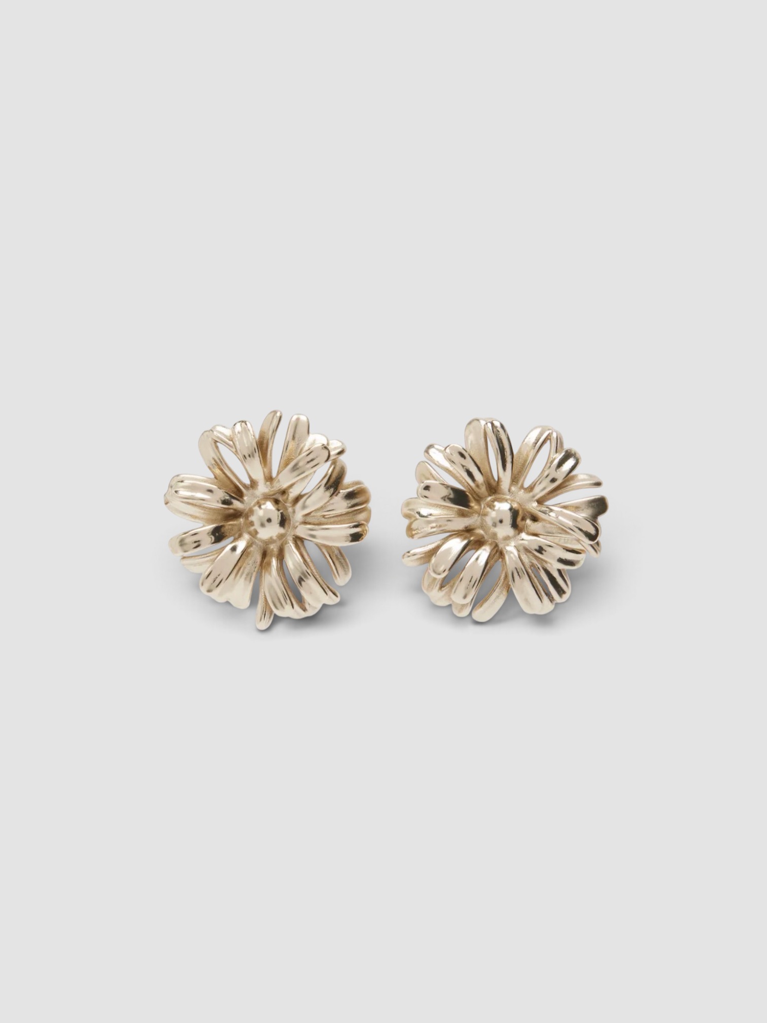 Dries Van Noten Floral Earrings in old brass.