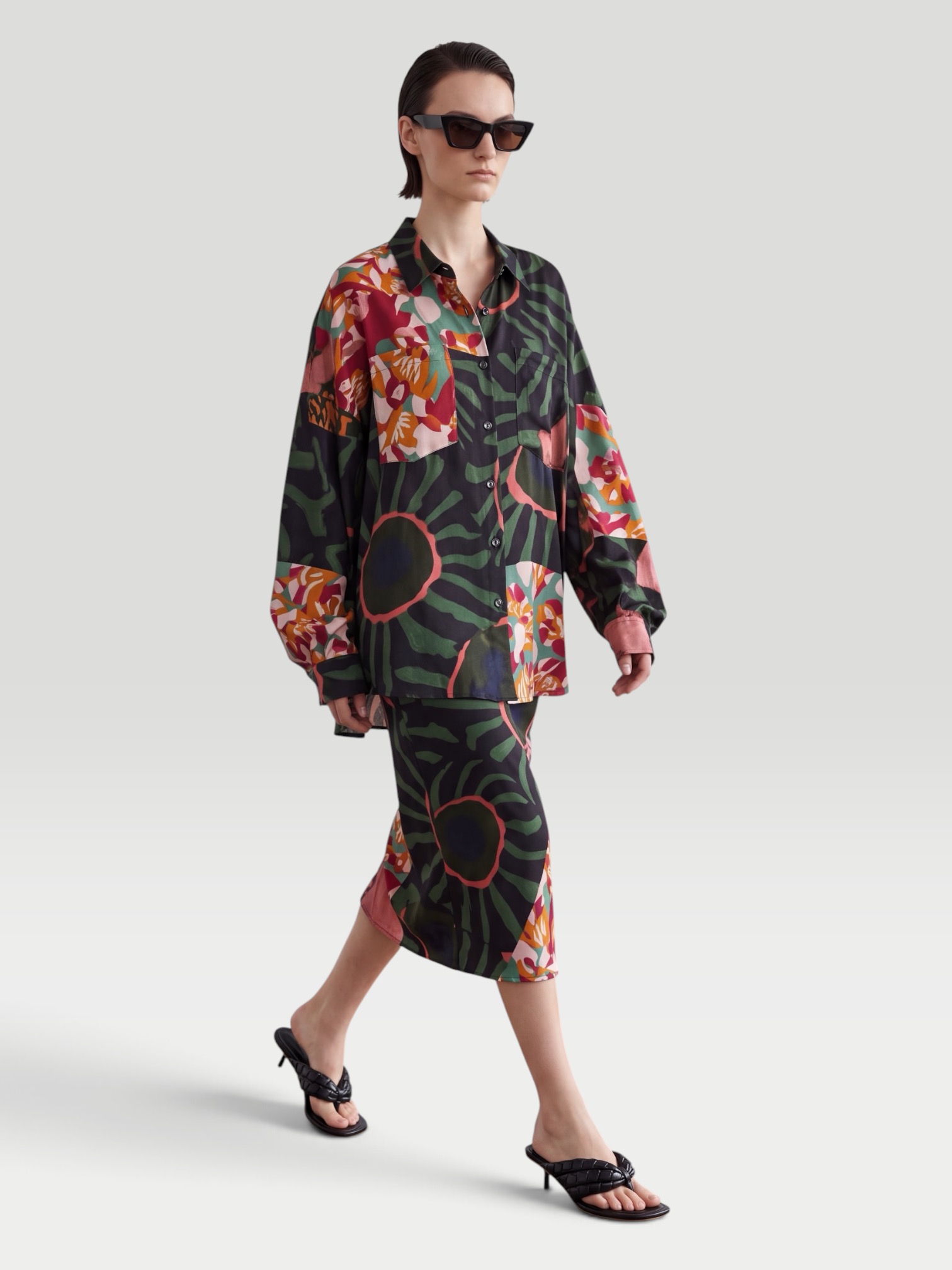 Dries Van Noten Printed Twill Shirt, worn with Dries Van Noten Printed Ruffled Midi Skirt, Bottega Veneta Sampieri Flat Thong, Bottega Veneta Aviator-Style Tortoiseshell Acetate Sunglasses, Bottega Veneta Loop Leather-Trimmed Raffia Tote Bag, the day. Styled by Sharon Lombardo for FDV Concierge.