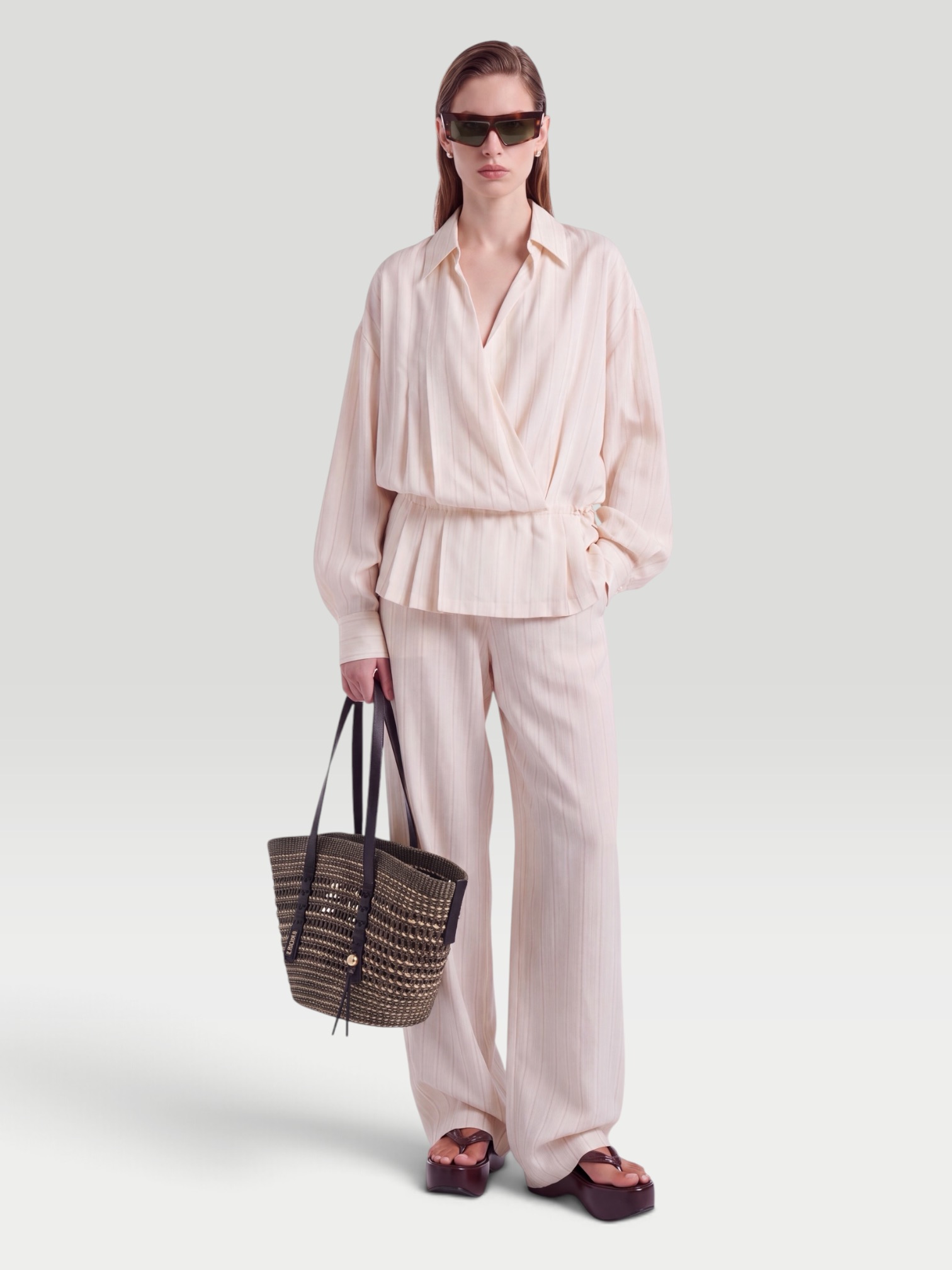 Dries Van Noten Striped Wide-Leg Pants in white. Styled by Sharon Lombardo for FDV Concierge.