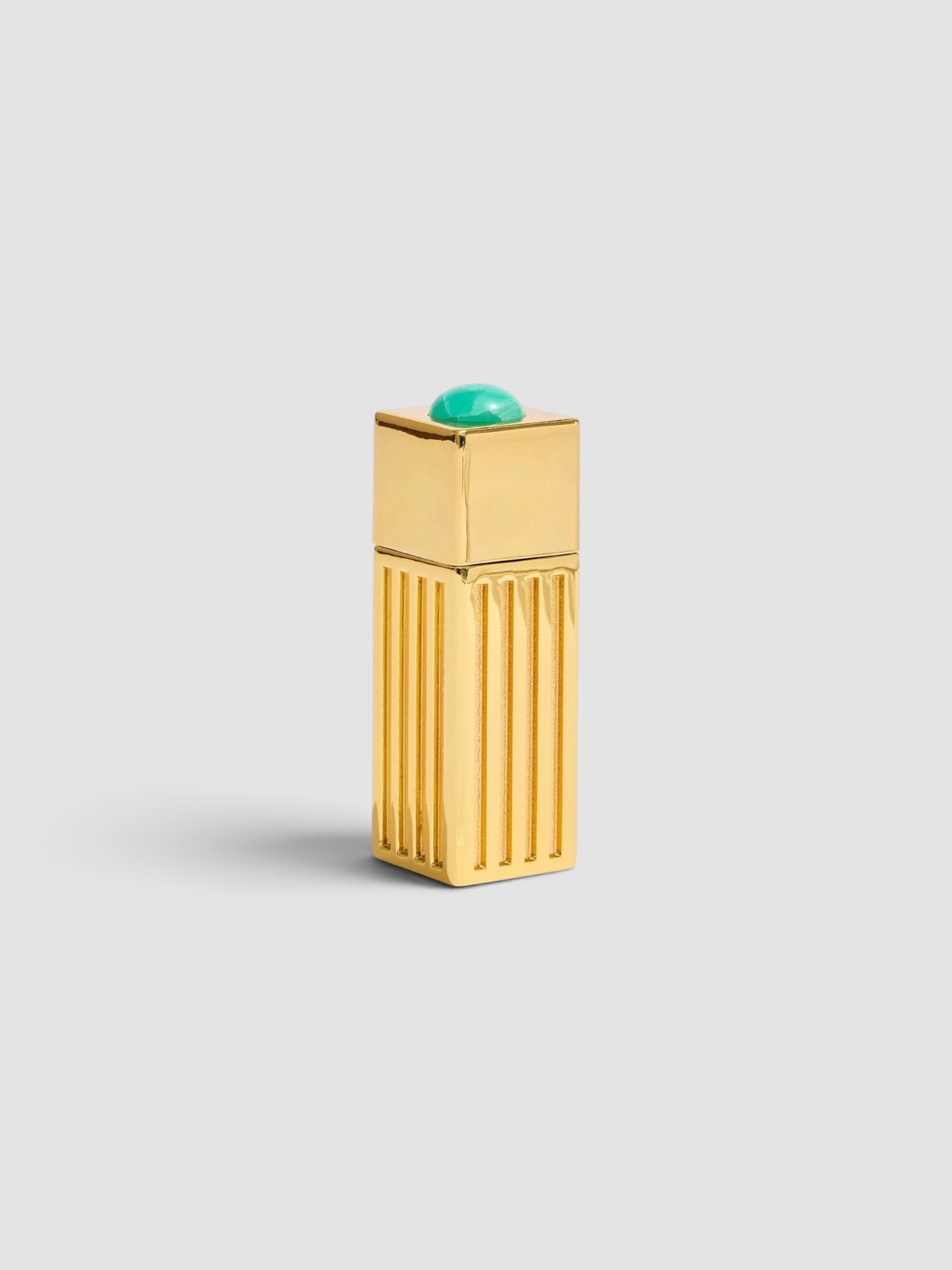Edie Parker Lipstick Lighter Case in gold.
