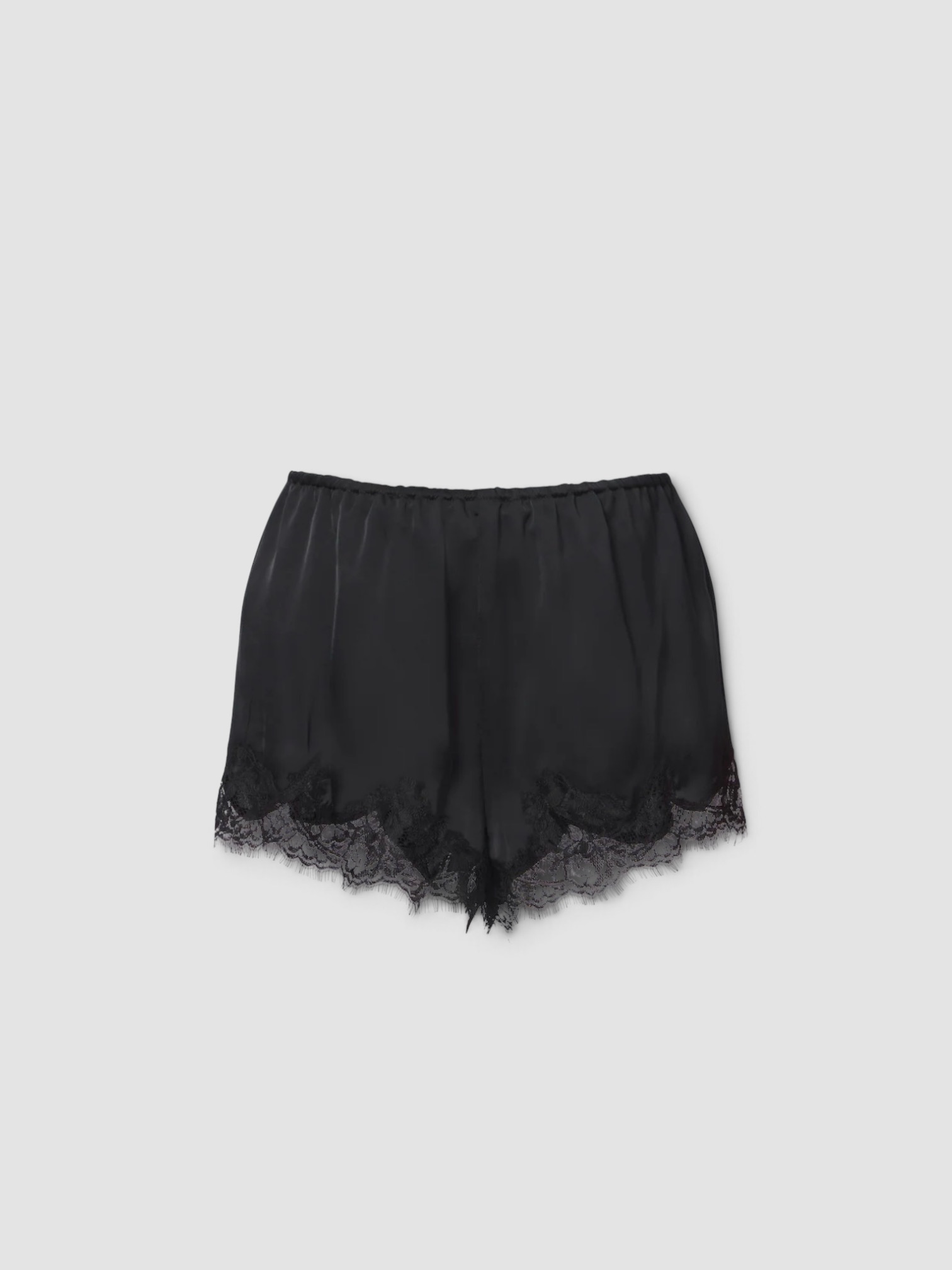 Faithfull Marisol Lace-Trimmed Satin Shorts in black, worn with Bottega Veneta Sampieri Flat Thong. Styled by Sharon Lombardo for FDV Concierge.