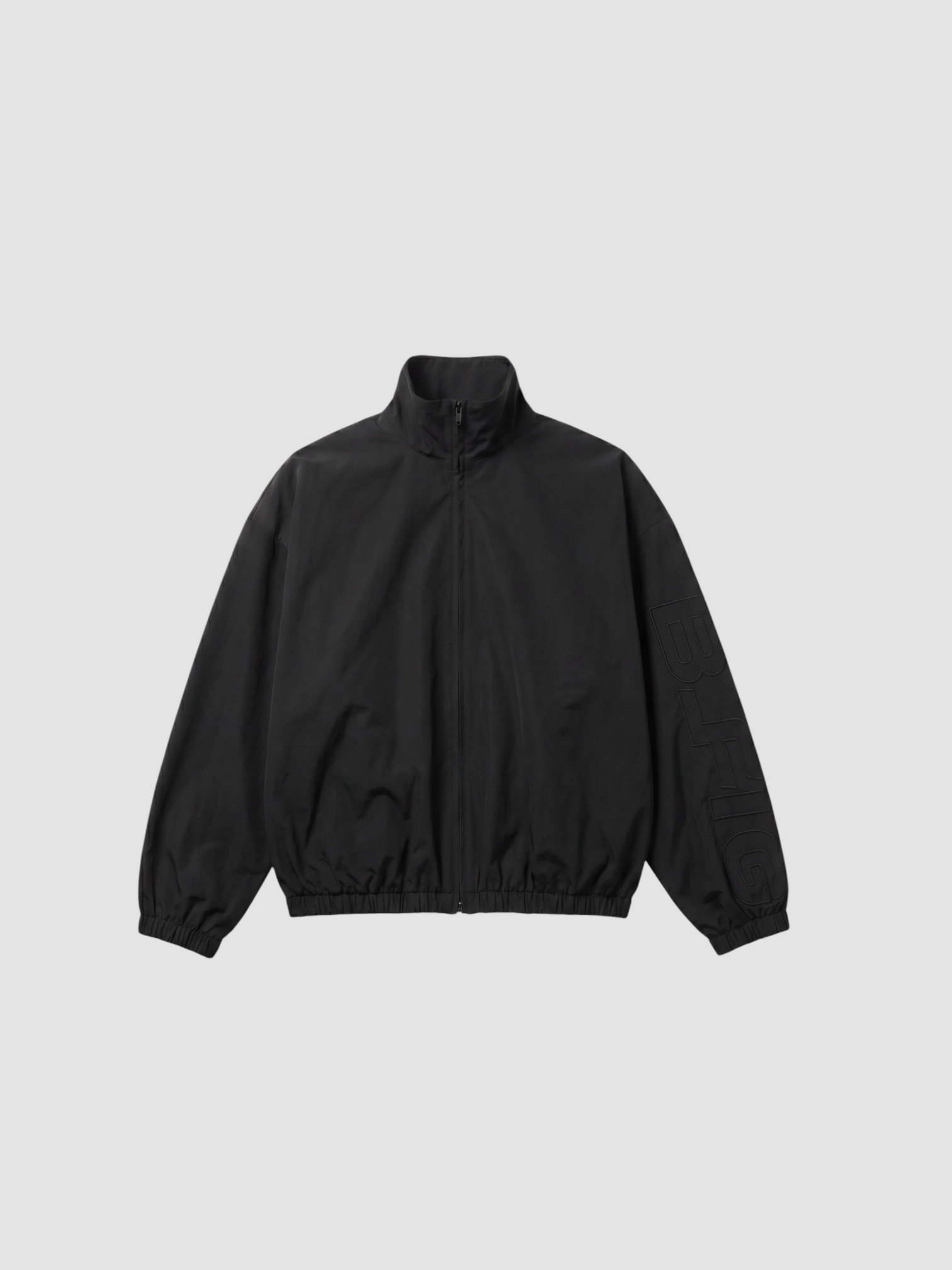 Fear Of God Essentials Active Trace Full Zip Track Jacket in vintage black. Styled by Sharon Lombardo for FDV Concierge.