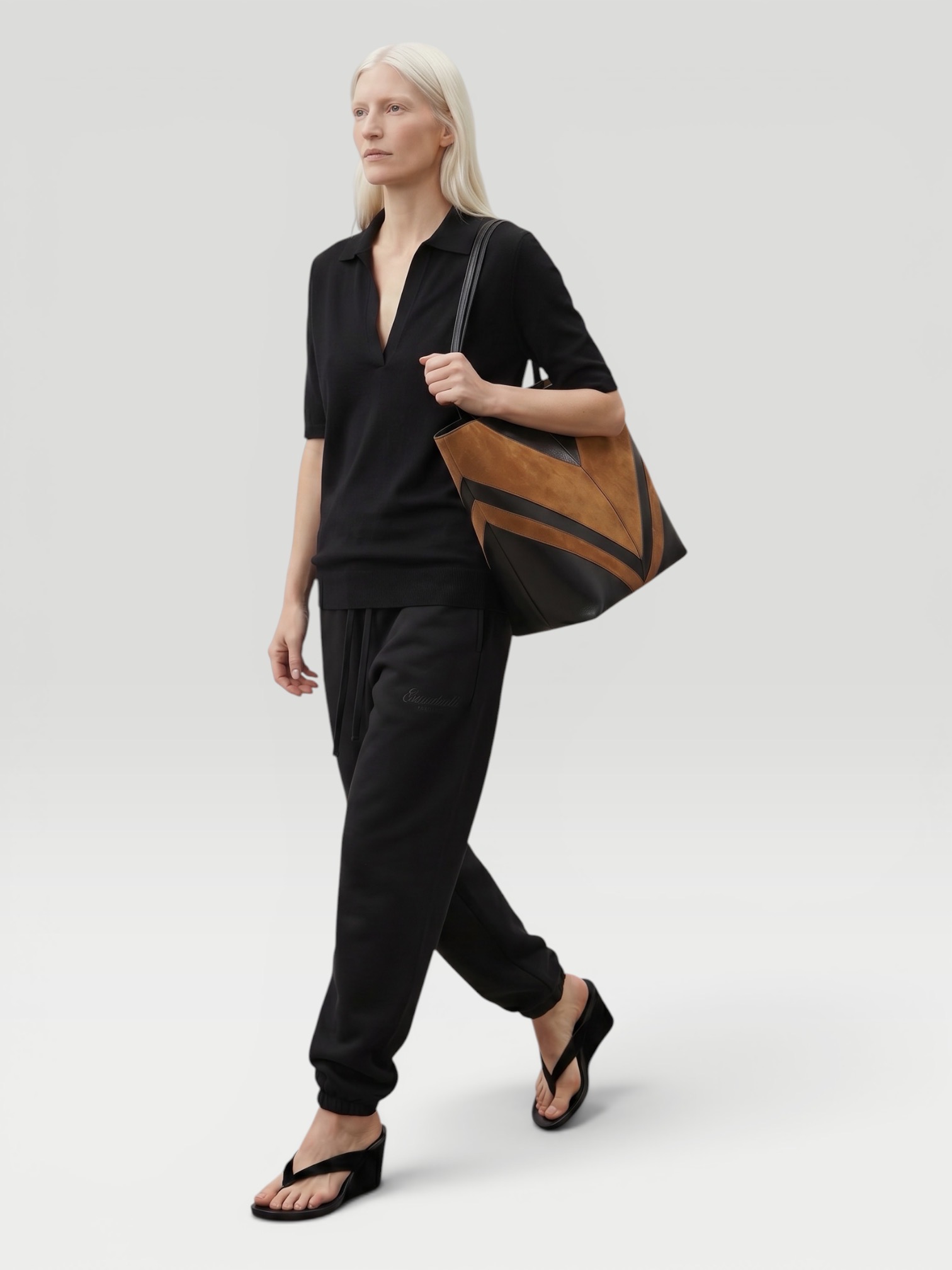 Fear Of God Essentials Active Trace Track Pant in vintage black. Styled by Sharon Lombardo for FDV Concierge.