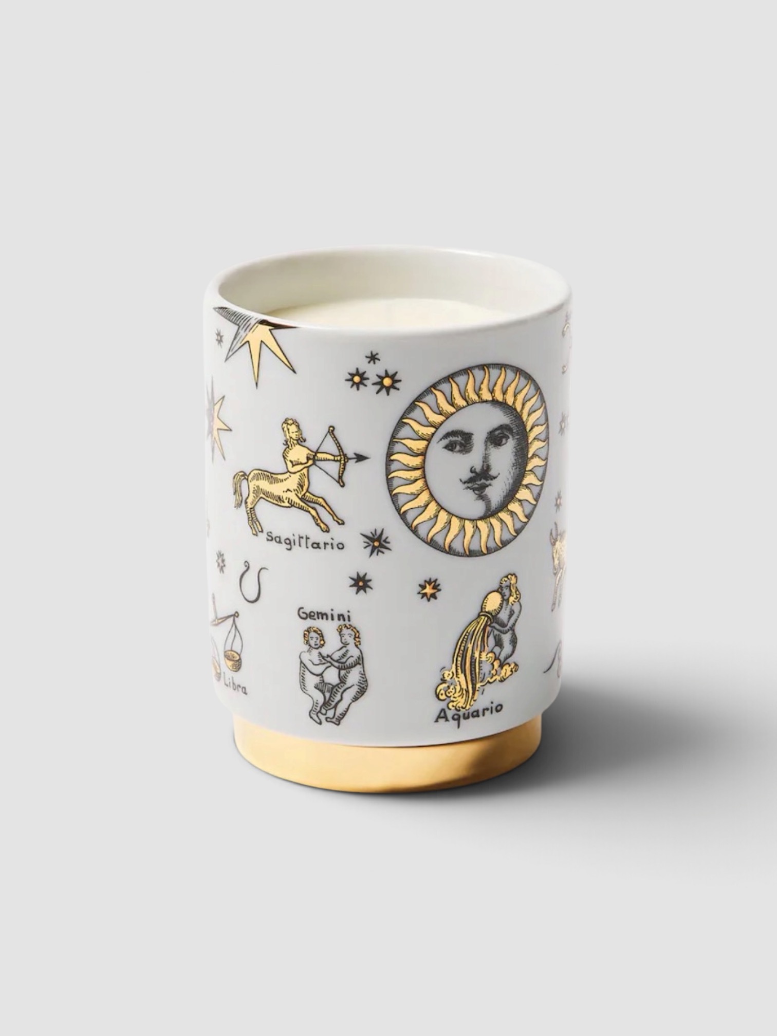 Fornasetti Astronomici Porcelain Scented Candle in gold.