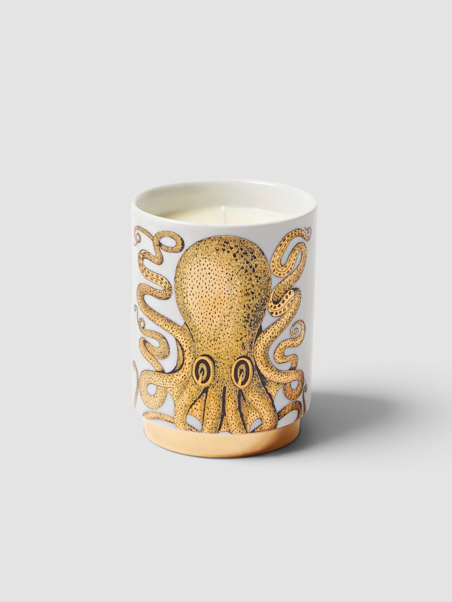 Fornasetti Polipo Immaginazione Scented Candle in gold.